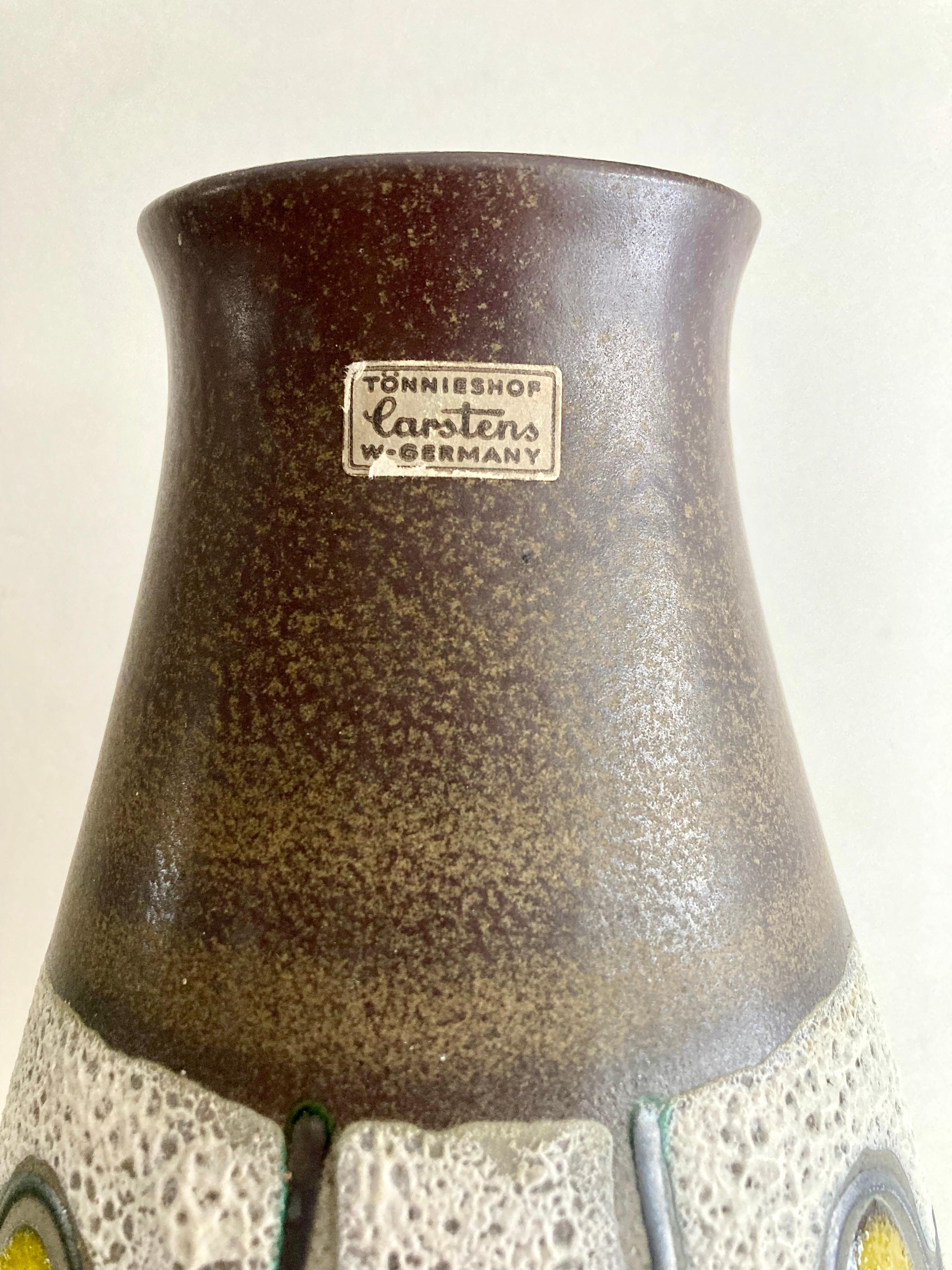 This authentic mid-century modern ceramic vase was made by the West German art pottery producer Carstens Tönnieshof in the 1960s. As can be seen from the embossed markings on the base, this is model number 1239-35 (see photos). The vase has been
