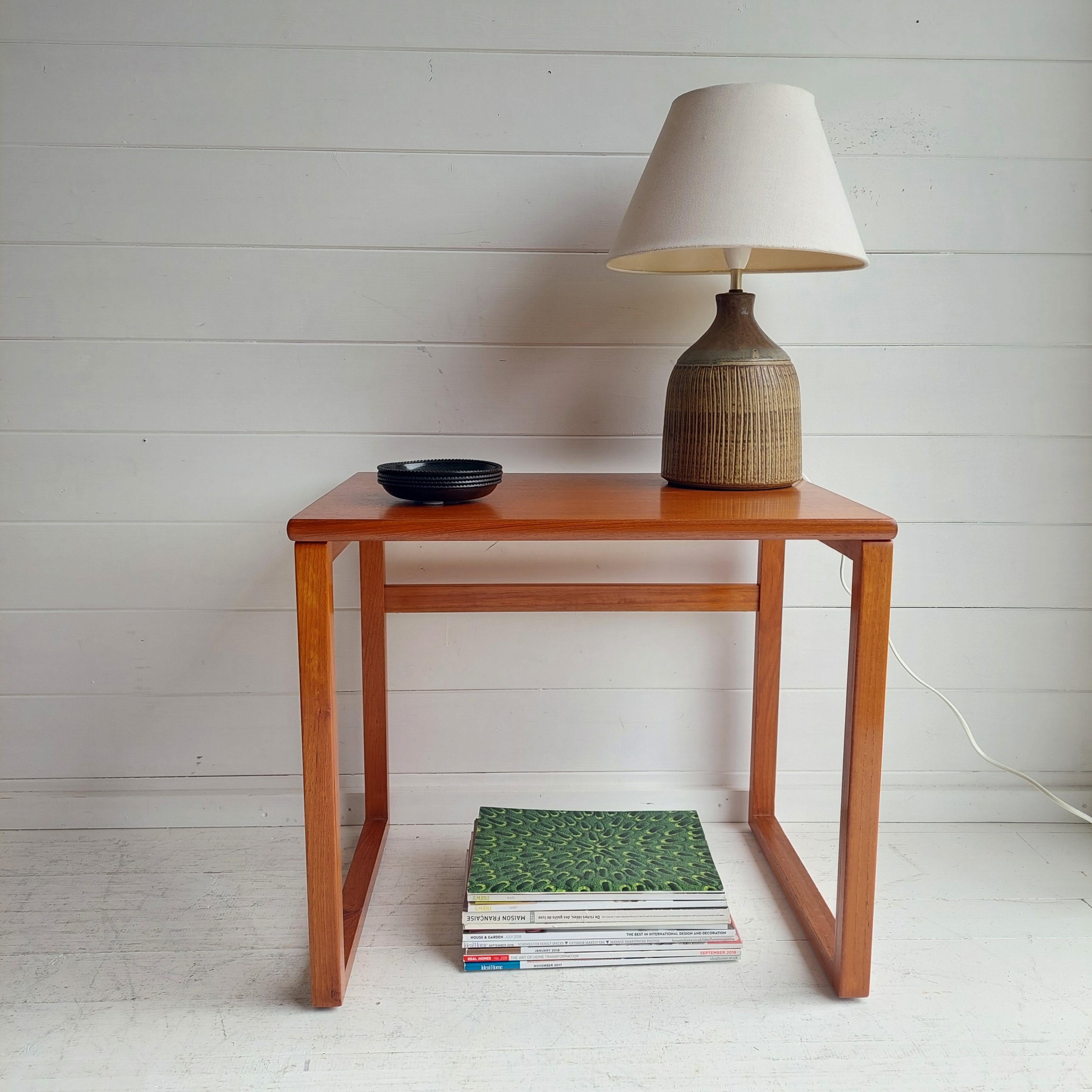An understated, minimalist teak mid century modern side table c.1970s/80s

A very elegant design with beautiful styled cube leg style base.
Mid century modern era
Gplan in style
Cube design with simple but elegant lines
Scandinavian in