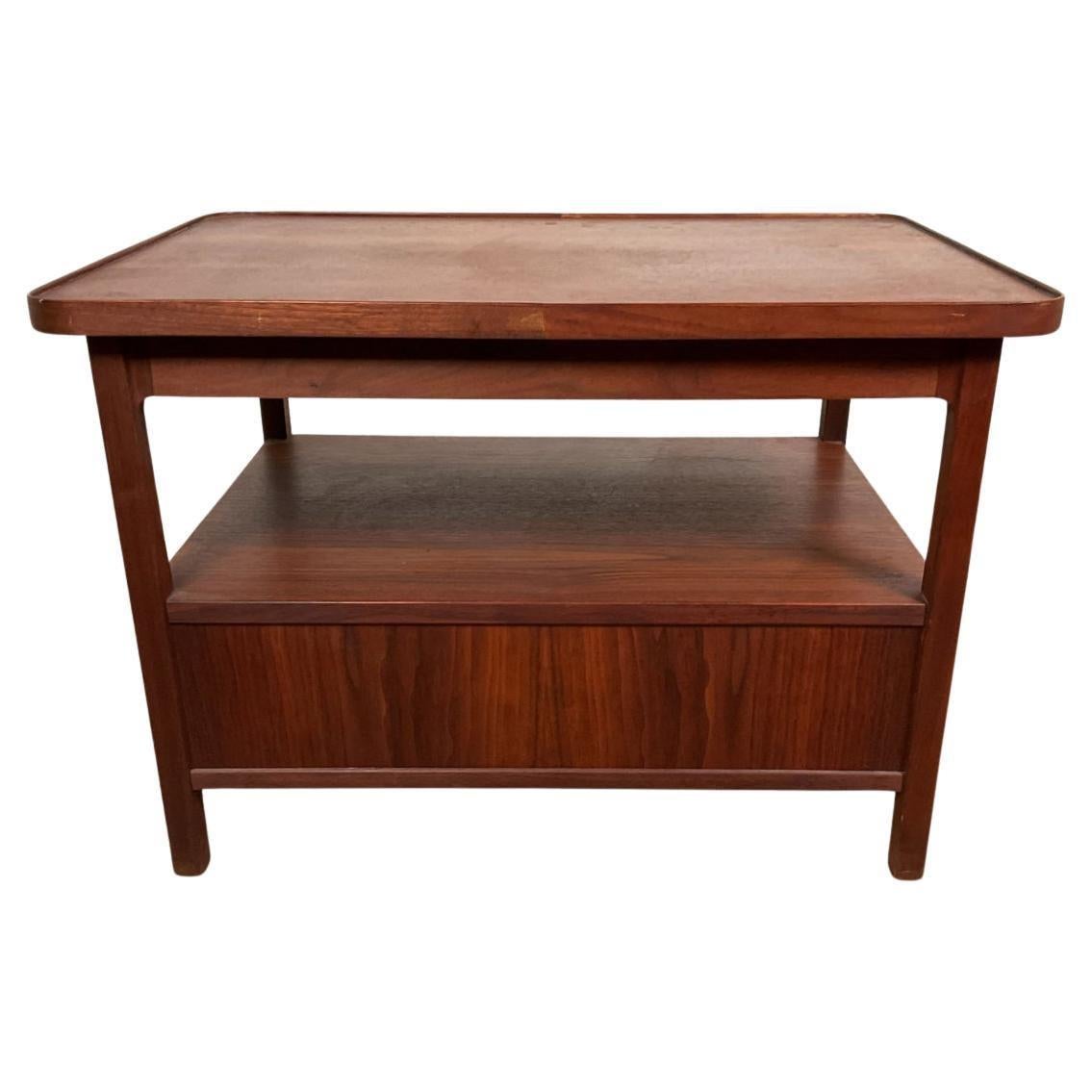 Mid century 2 drawer walnut nightstand by Jack Cartwright for Founders. Jack Cartwright for Founders, mid-century modern two drawer side table / nightstand with black knobs. Made in USA Circa 1960. Located in Brooklyn NYC.

Only (1) available