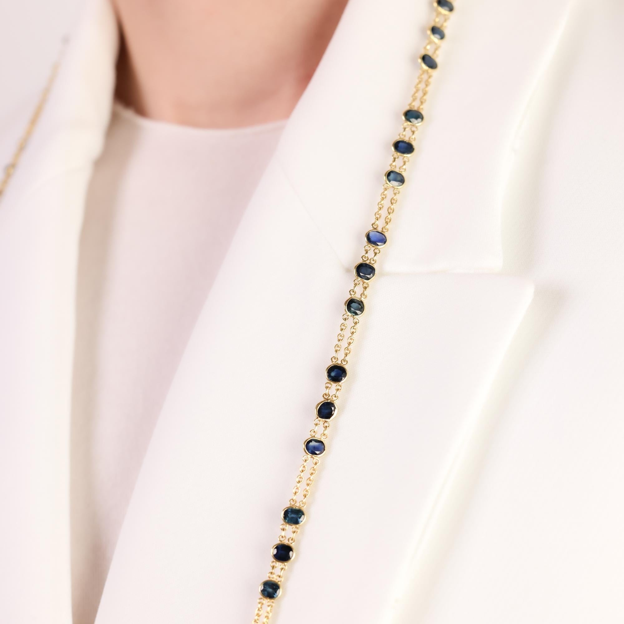 A stunning Mid-Century 18k yellow gold necklace, adorned with 69 oval cut blue sapphires totaling 20 carats, offering timeless elegance and vintage charm.

Center stone: 69 oval cut blue sapphires
Total sapphire weight: Approximately 20