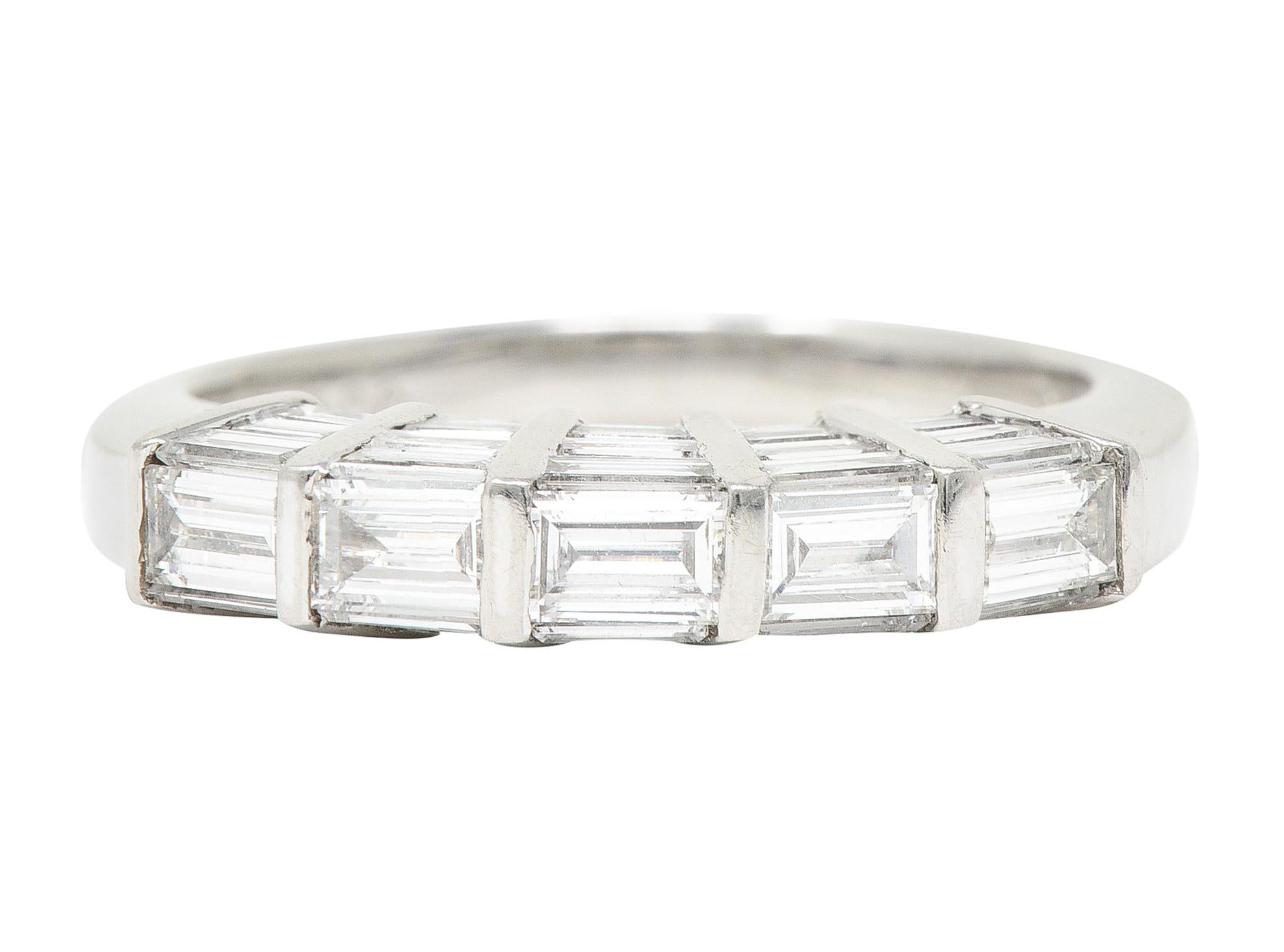 Ring features baguette cut diamonds bar set across top and profile - graduating in size. Weighing approximately 2.00 carats total - F/G in color with VS clarity. Inscribed with carat weight. Completed by high polished finish. Stamped for platinum.