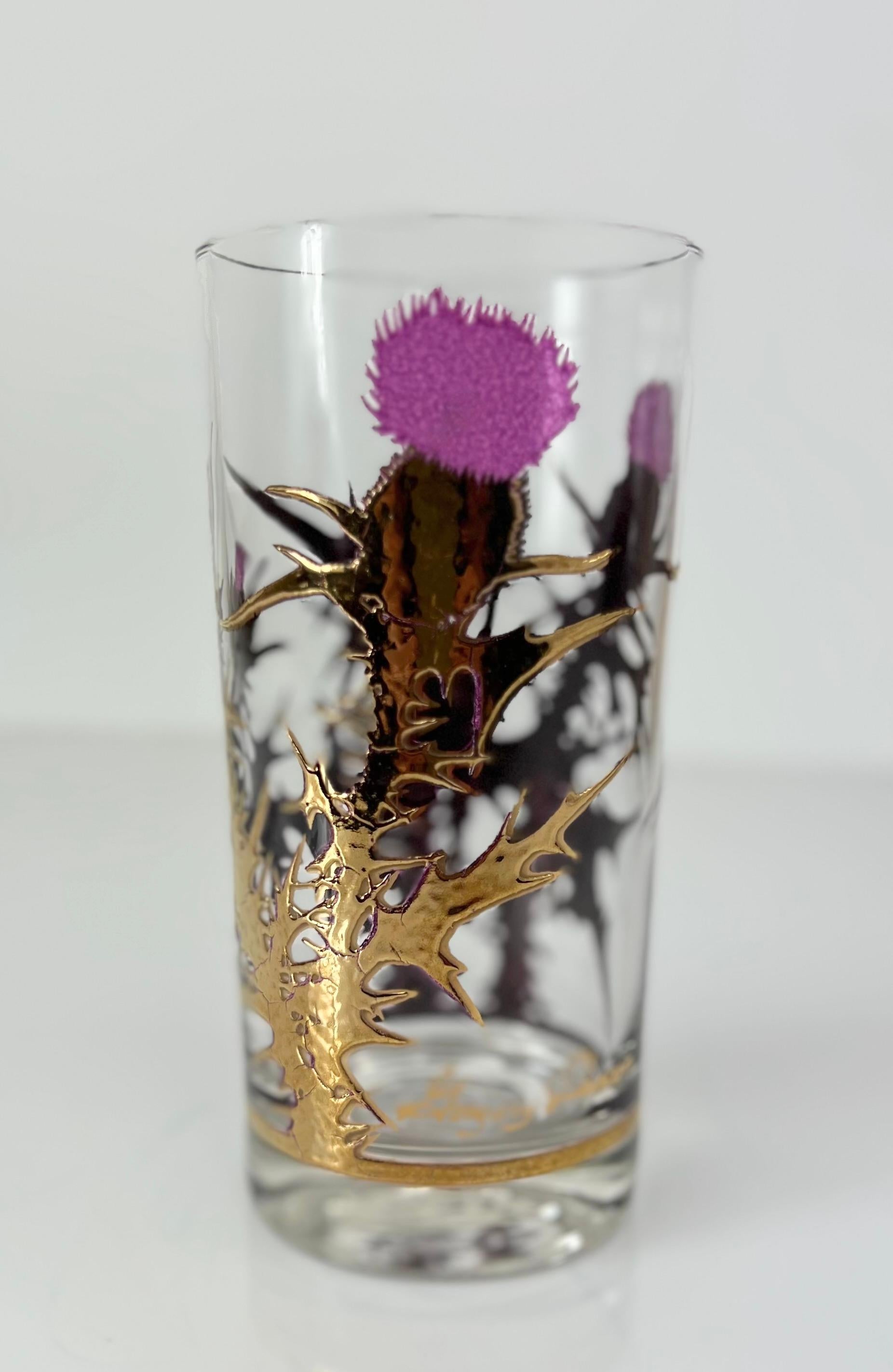 Stunning mid century modern glassware set by Gregory Duncan for West Virginia Glass.  This set of 8 “Thistle” pattern glasses feature raised texture 22 karat gold stem with translucent purple enamel thistle flower.  The set is easily the most