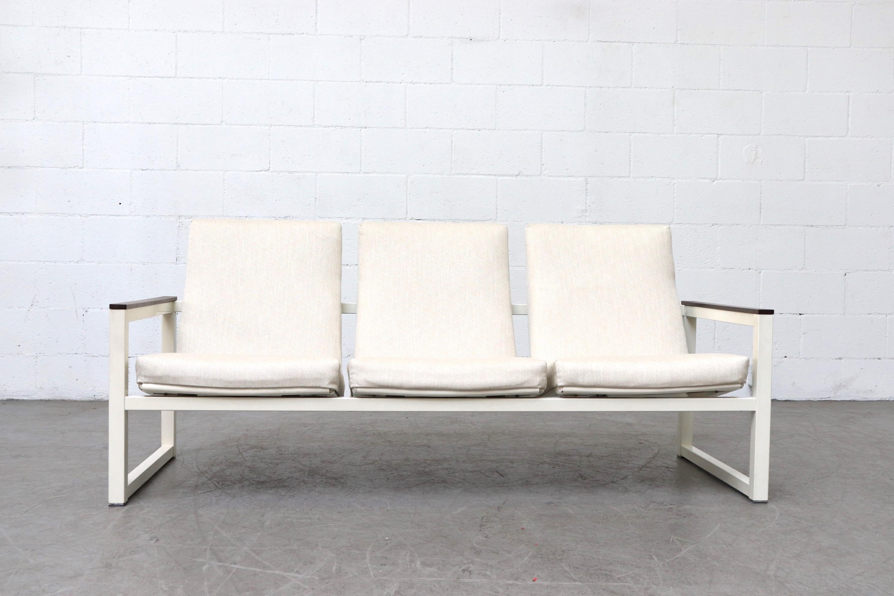 Midcentury 3-seat sofa by Friso Kramer and Tjerk Reijenga for Pilastro. Newly Upholstered in bone white fabric. Sofa frame in original condition with some signs of wear including some enamel wear and Minimal chipping, wear is consistent with its age