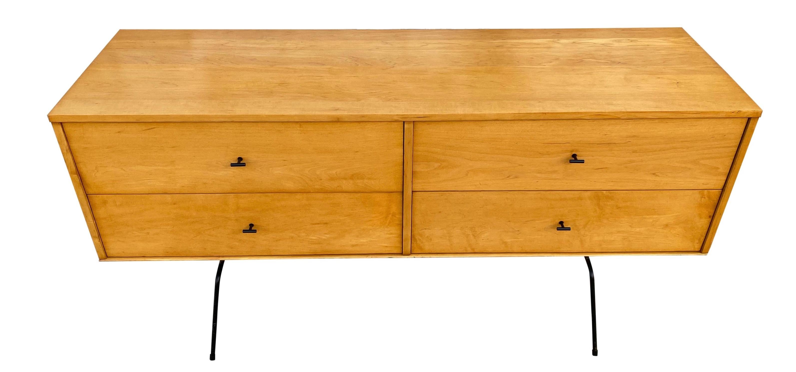 Rare midcentury low dresser credenza by Paul McCobb circa 1950 Planner Group #1504 with 4 low drawers - Solid maple construction has a raw blonde maple lacquered finish. All original Black Steel T Pulls. Sits on a 60