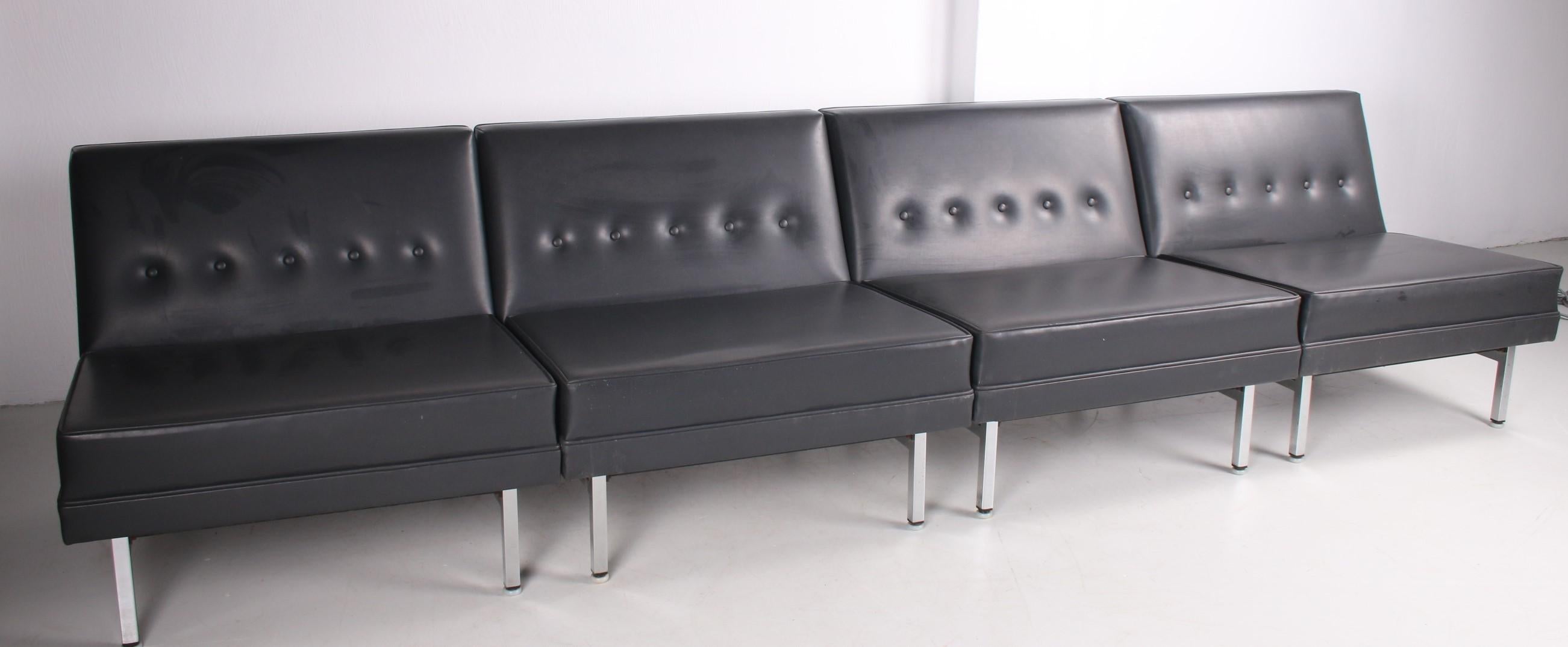 Designed by George Nelson, this living room set is an iconic piece of Mid-Century Modern design! Manufactured by Herman Miller in the United States of America, circa 1960.

The set contains 4 separate seating elements covered with black imitation
