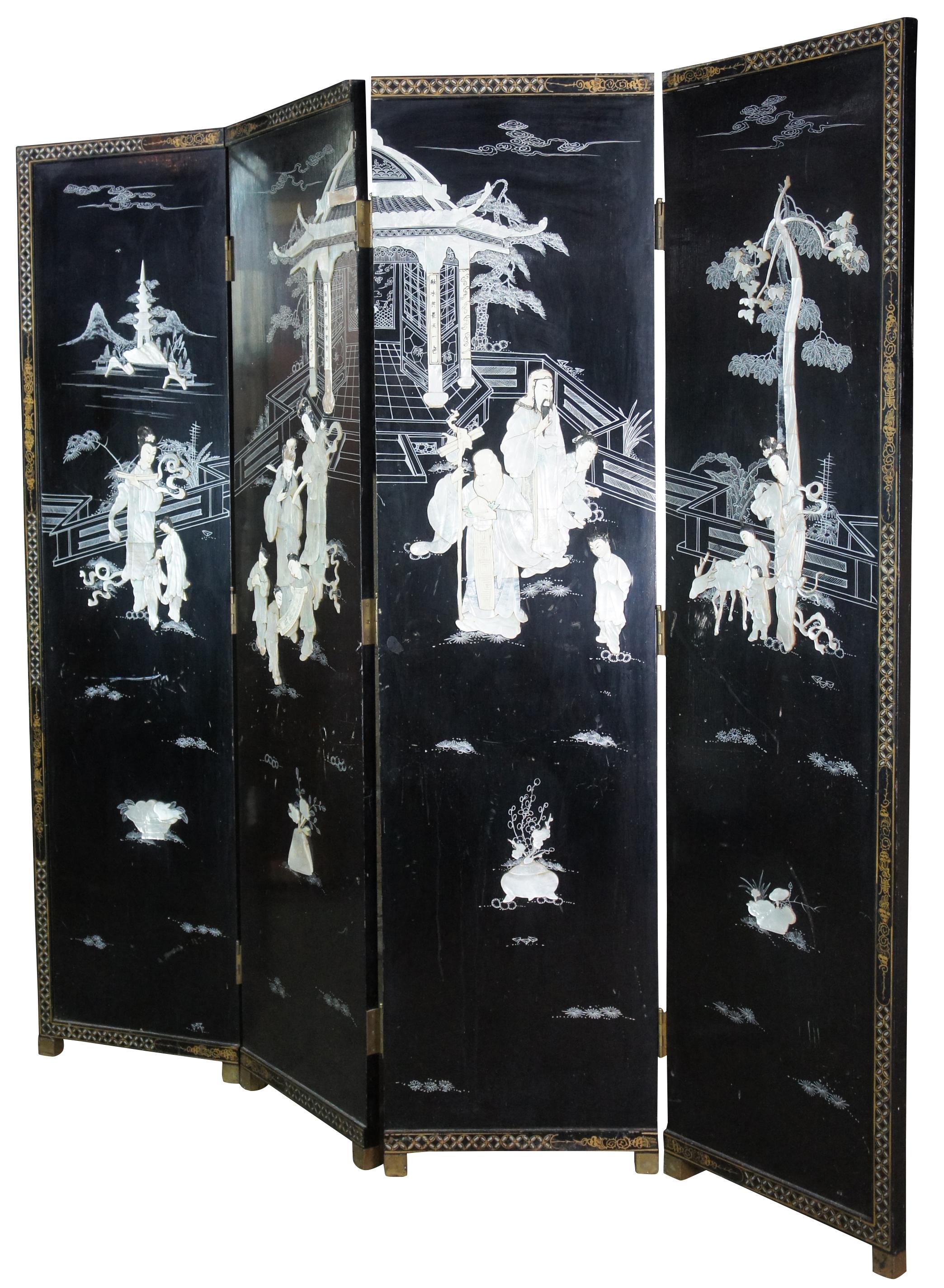 Mid 20th century Chinese four panel wall divider or screen. Made of wood featuring black lacquer with mother of pearl and soapstone landscape screen of geishas with children and animals outside of a pagoda or temple. Accented with decorative gold