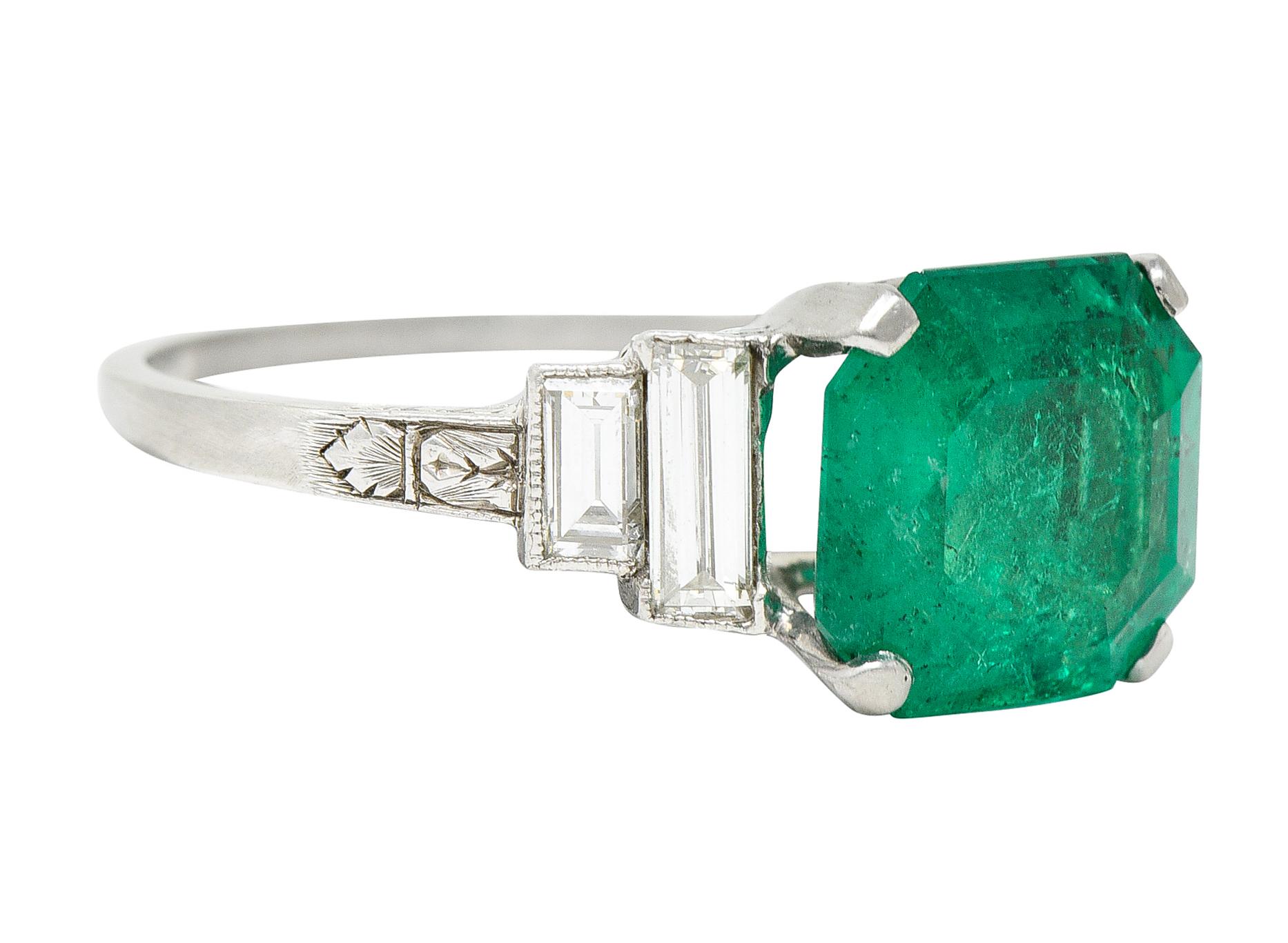 Featuring an octagonal cut Colombian emerald weighing approximately 3.43 carats

Very slightly blueish and strongly green in color - translucent with natural inclusions and moderate clarity enhancement (F2)

Basket set and flanked by stepped