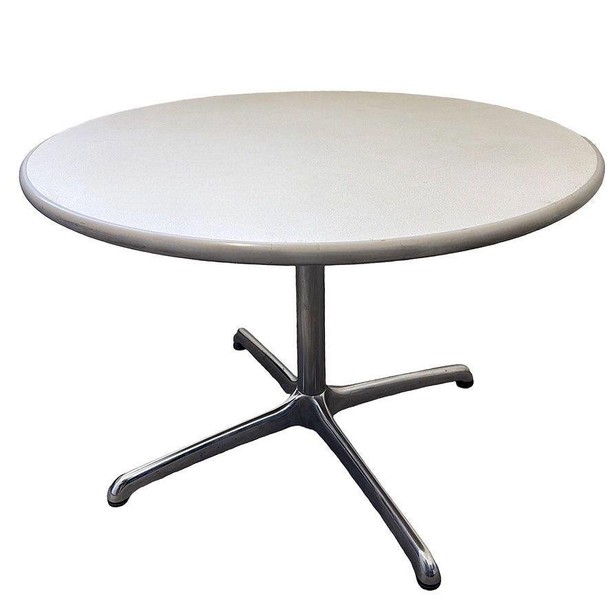 Late Mid-century Tulip inspired Steelcase 42″ office dining lunch round table with a laminate grey top and chromed steel base.It features a sleek, neutral surface that resists wear while offering an understated sophistication. Supported by a