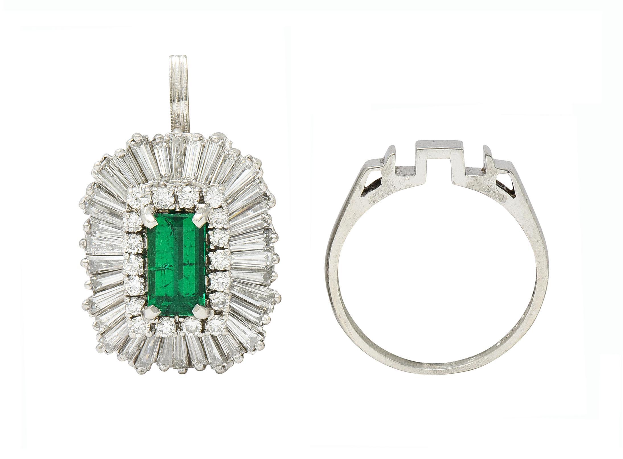 Centering an emerald cut emerald weighing 1.21 carats total - transparent medium green
Natural Colombian in origin with minor clarity enhancement (FI) 
With a halo surround of round brilliant and single cut diamonds 
Weighing approximately 0.45