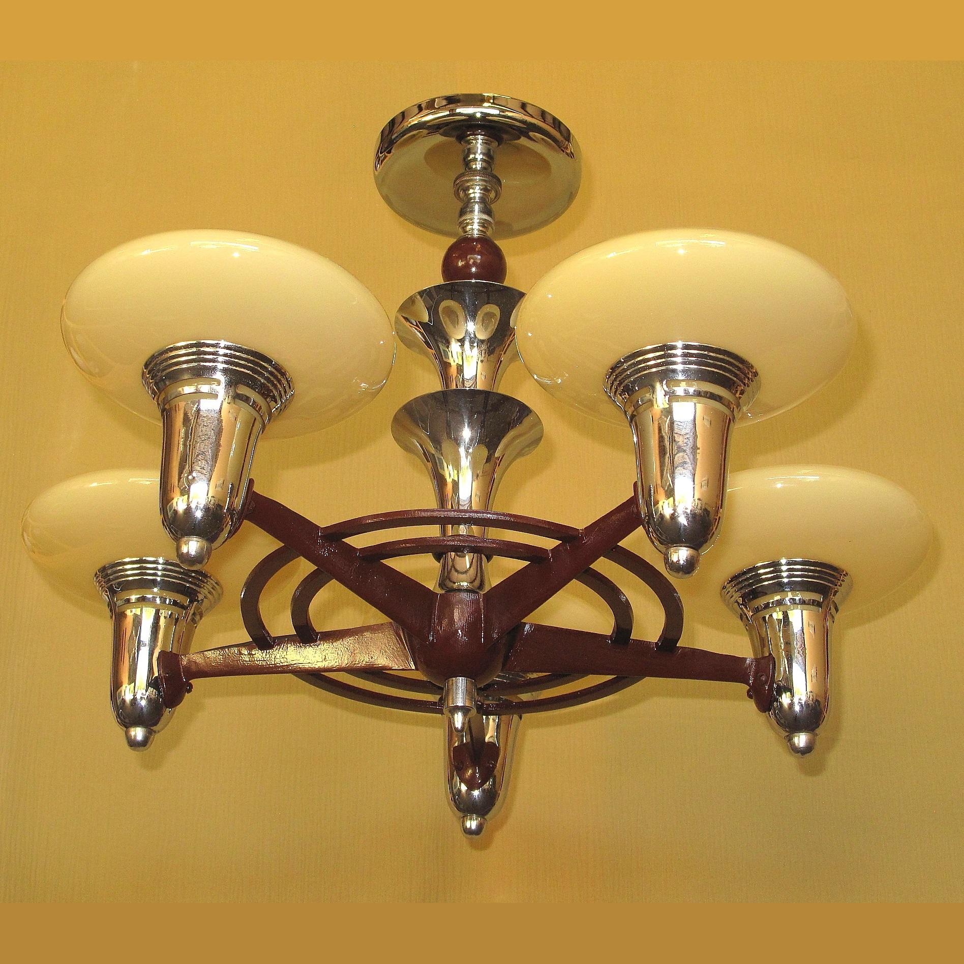 This cast iron and chrome fixture shows the distinct direction design & style was taking in the 1930s, moving from Art Deco to what we now call Mid-Century Modern, strong clean lines without the ornamentation common in the Art Deco era.
The chrome