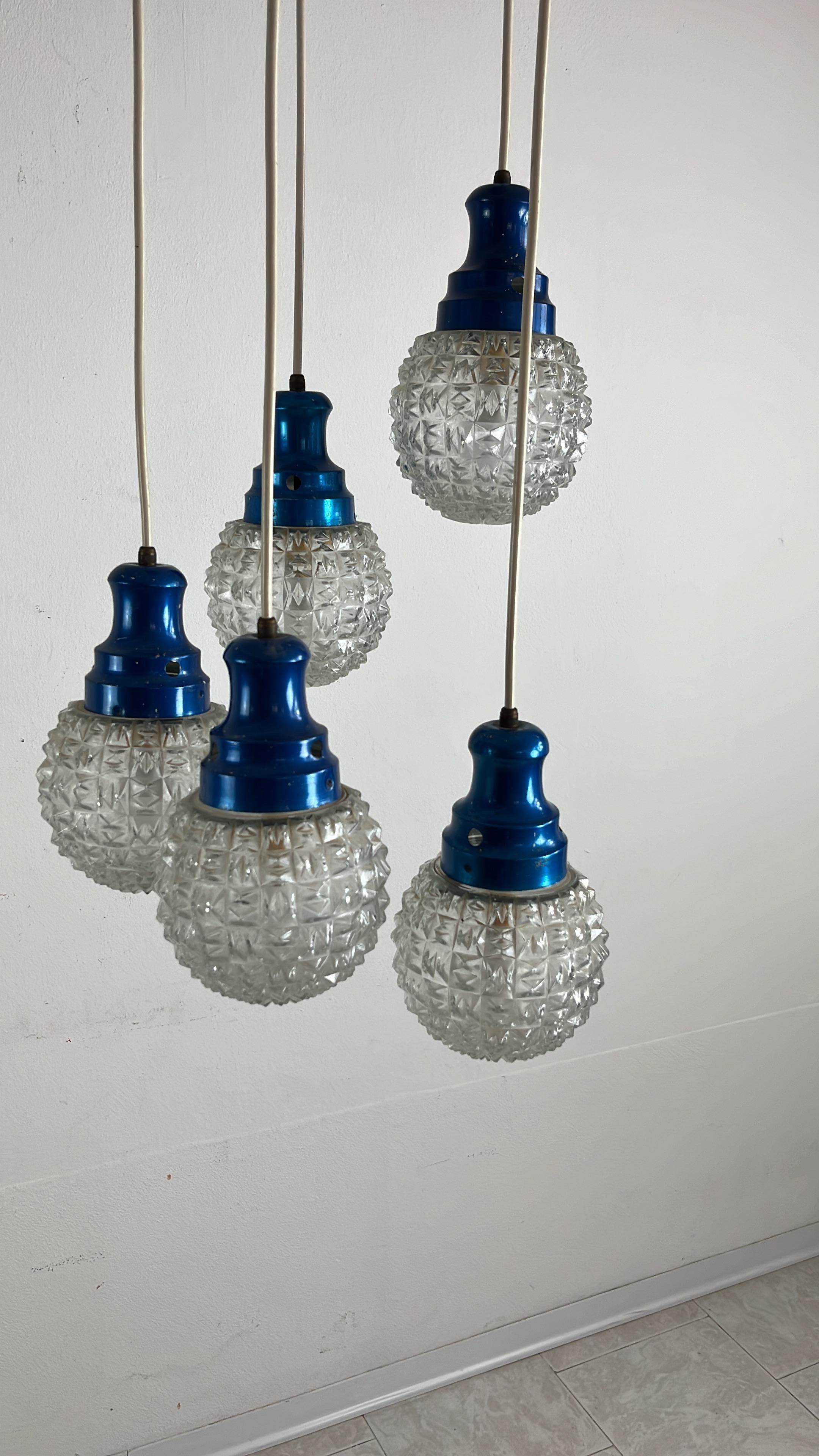 Mid-Century 5-light Chandelier Italian Design 1960s

Metal structure with brass elements. E16 lamps.
Intact and in good condition, small signs of aging.