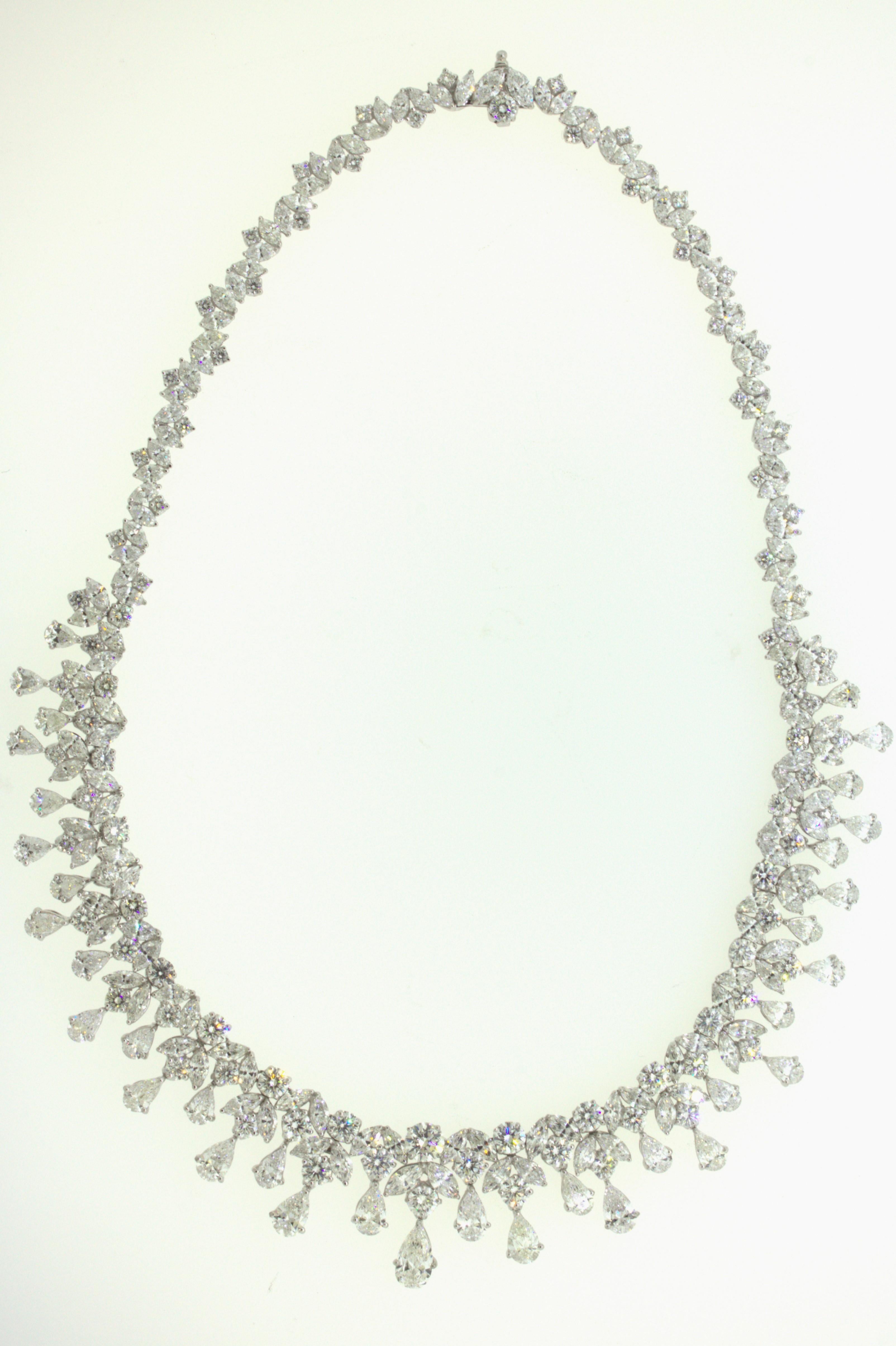 A chic and elegant diamond drop necklace worth of royalty. This large and impressive necklace features 54 carats of large sized round brilliant, marquise, and pear-shape diamonds. The pear-shapes are set as drops and graduate in size with the