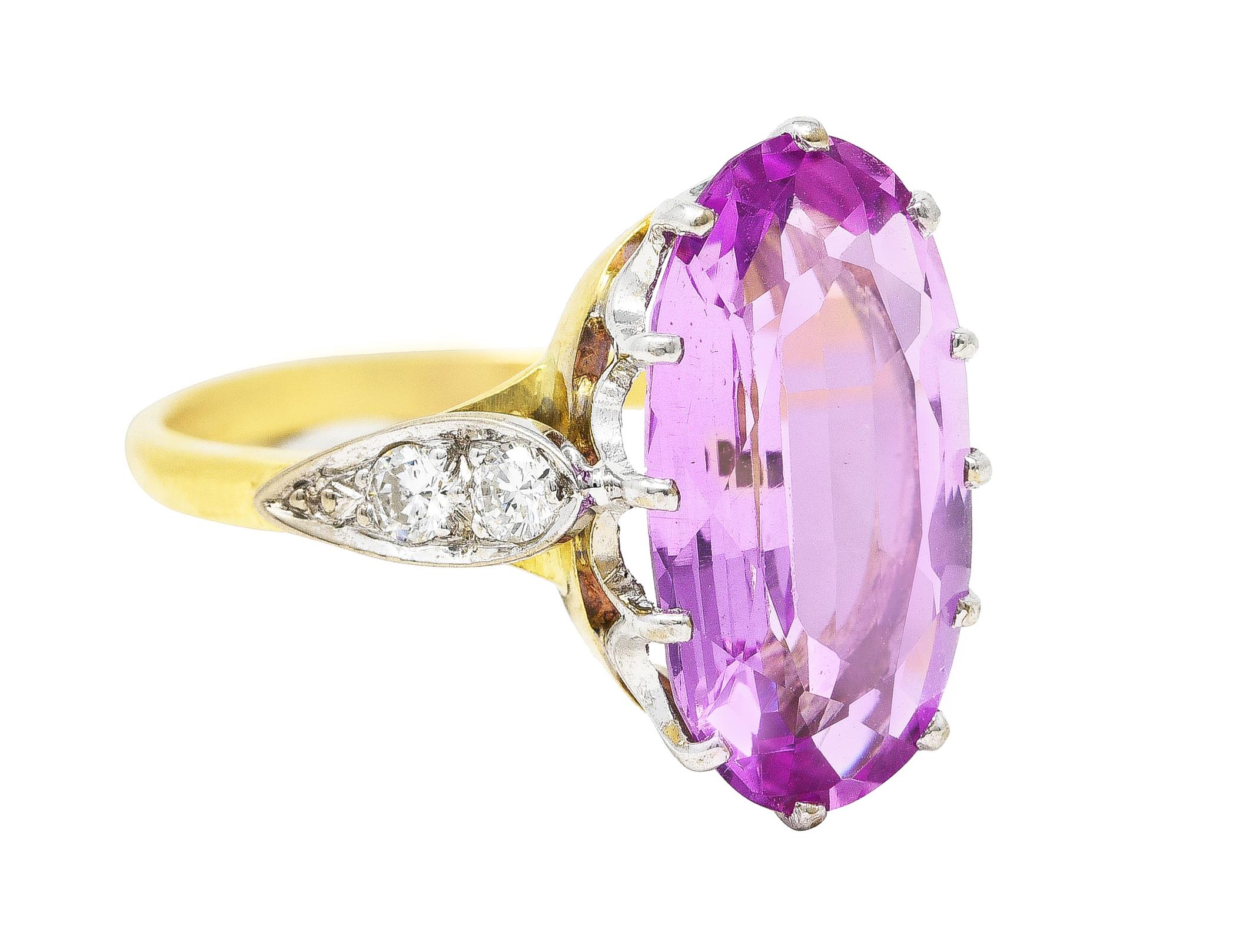 Featuring an elongated oval cut imperial topaz weighing approximately 5.20 carats. Transparent violetish pink in color - strong saturation. Prong set in a stylized white gold head with a deep scalloped motif. Flanked by white gold navette form
