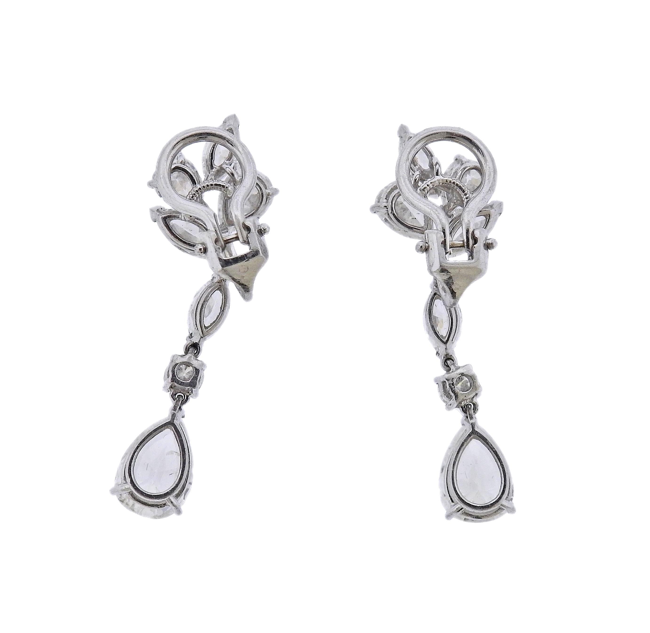 Pair of beautiful Mid Century platinum drop earrings, set with a total of approx. 7 carats in diamonds. Two bottom pear shaped diamonds are approx. 1.39ct and 1.51ct, H-I color and SI3/I1 in clarity. The top diamonds are approx. G-H/SI. Earrings are