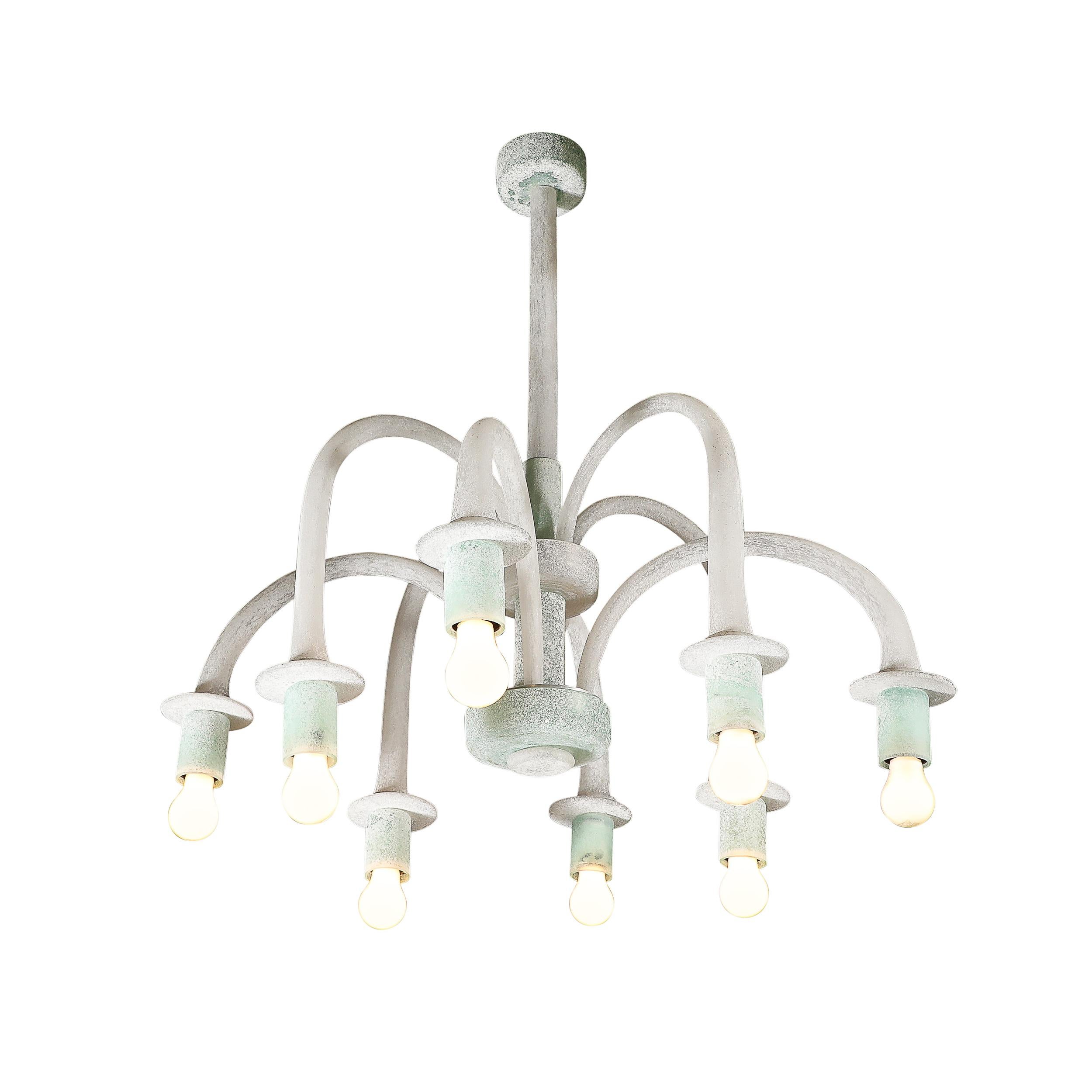 This materially dynamic and highly coveted Mid-Century Modernist Eight Arm Curved Hand-Blown Murano Scavo Glass Chandelier in White and Jade is by the esteemed glass house of Seguso and originates from Italy, Circa 1970. Features a minimal take on a