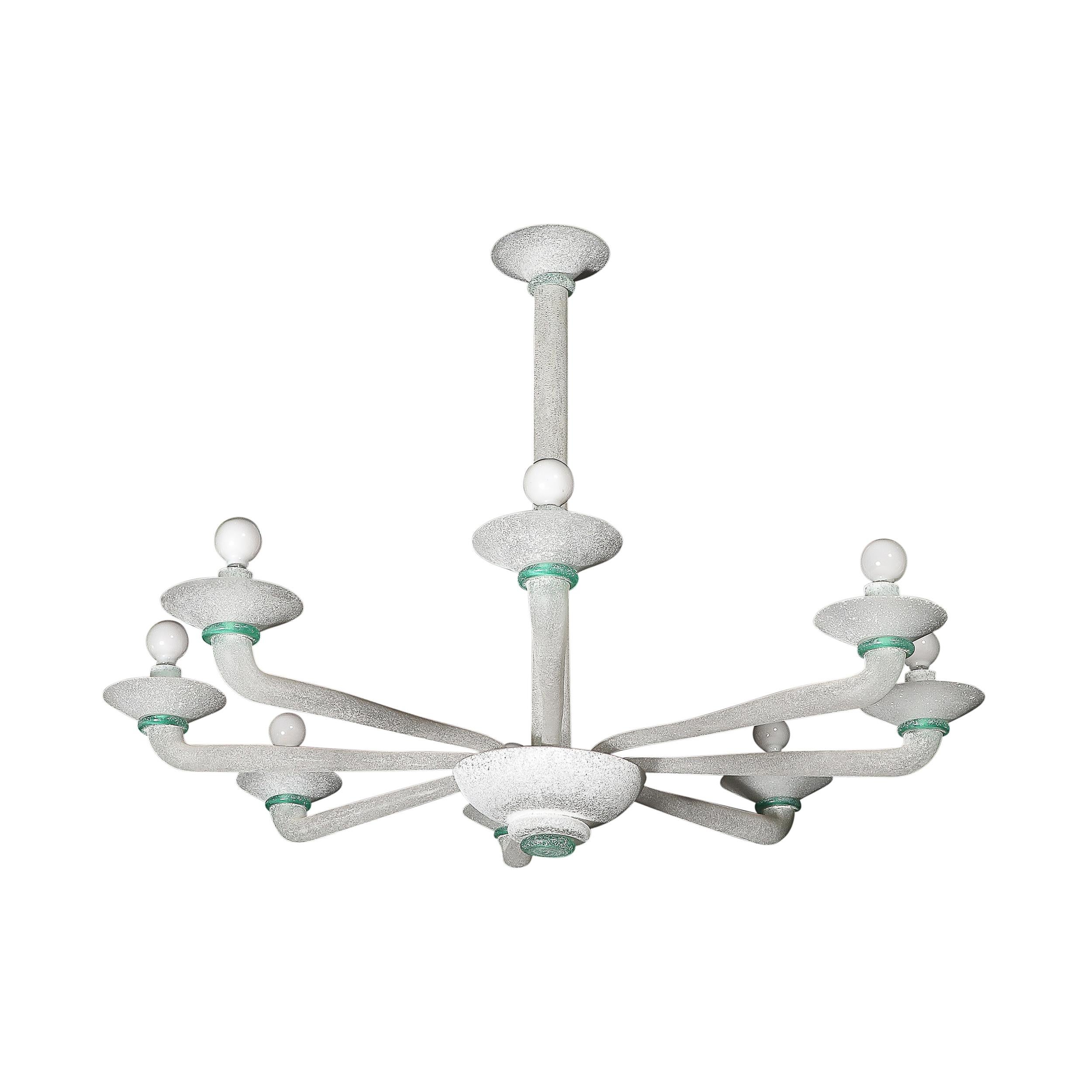 This materially dynamic and highly coveted Mid-Century Modernist Eight Arm Curved Hand-Blown Murano Scavo Glass Chandelier in White and Jade is by the esteemed Art Glass atelier  Seguso and originates from Italy, Circa 1970. Features a minimal take