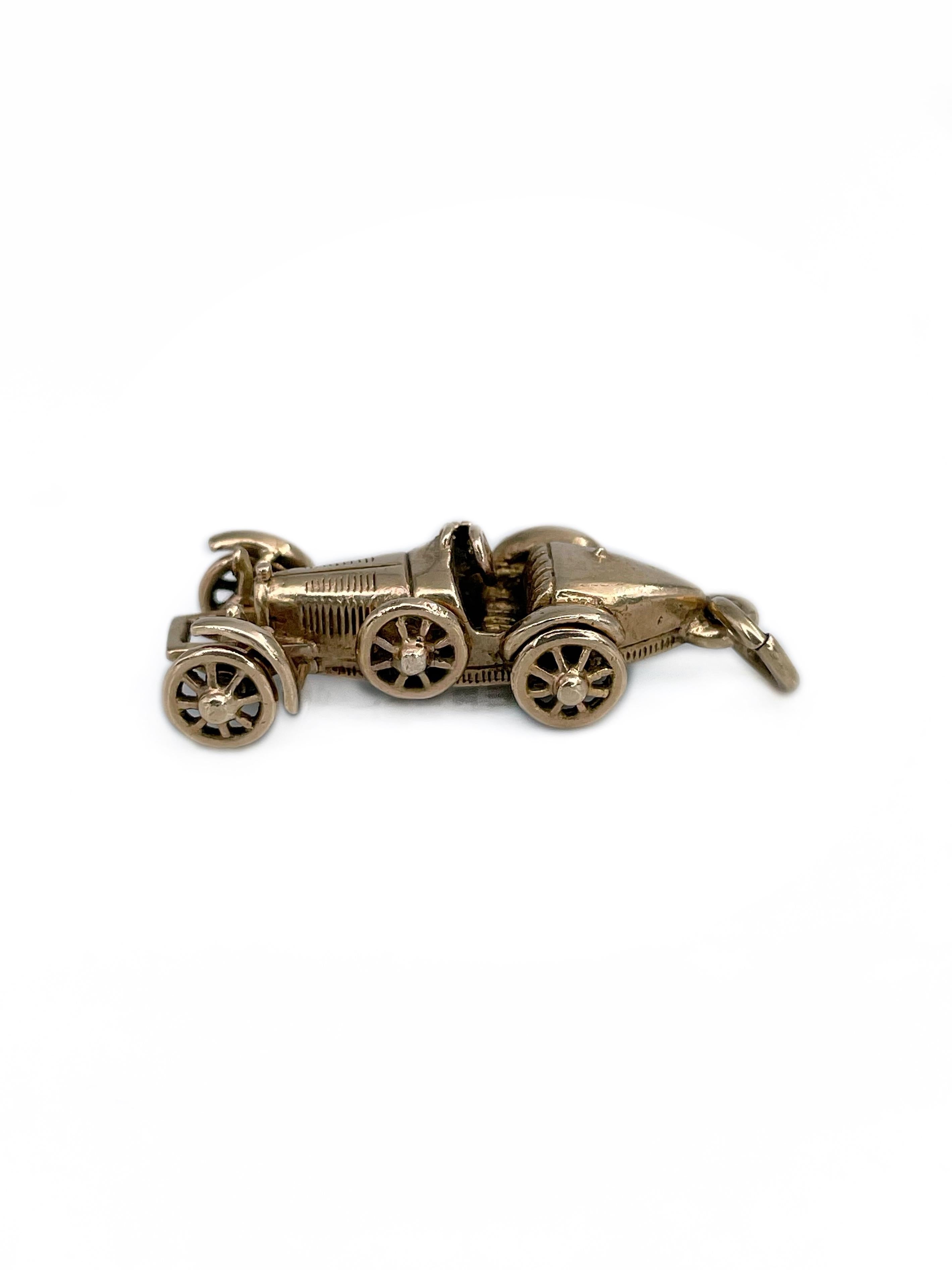 This is a car figure charm pendant crafted in 9K gold. Circa 1960. 

The piece is showcasing a detailed Bugatti Type 35 model. Main four wheels are moving (can be seen in a video). 

Collectable. 

Signed: “Bugatti Type 35 E&H REGD PATT 375”

Size: