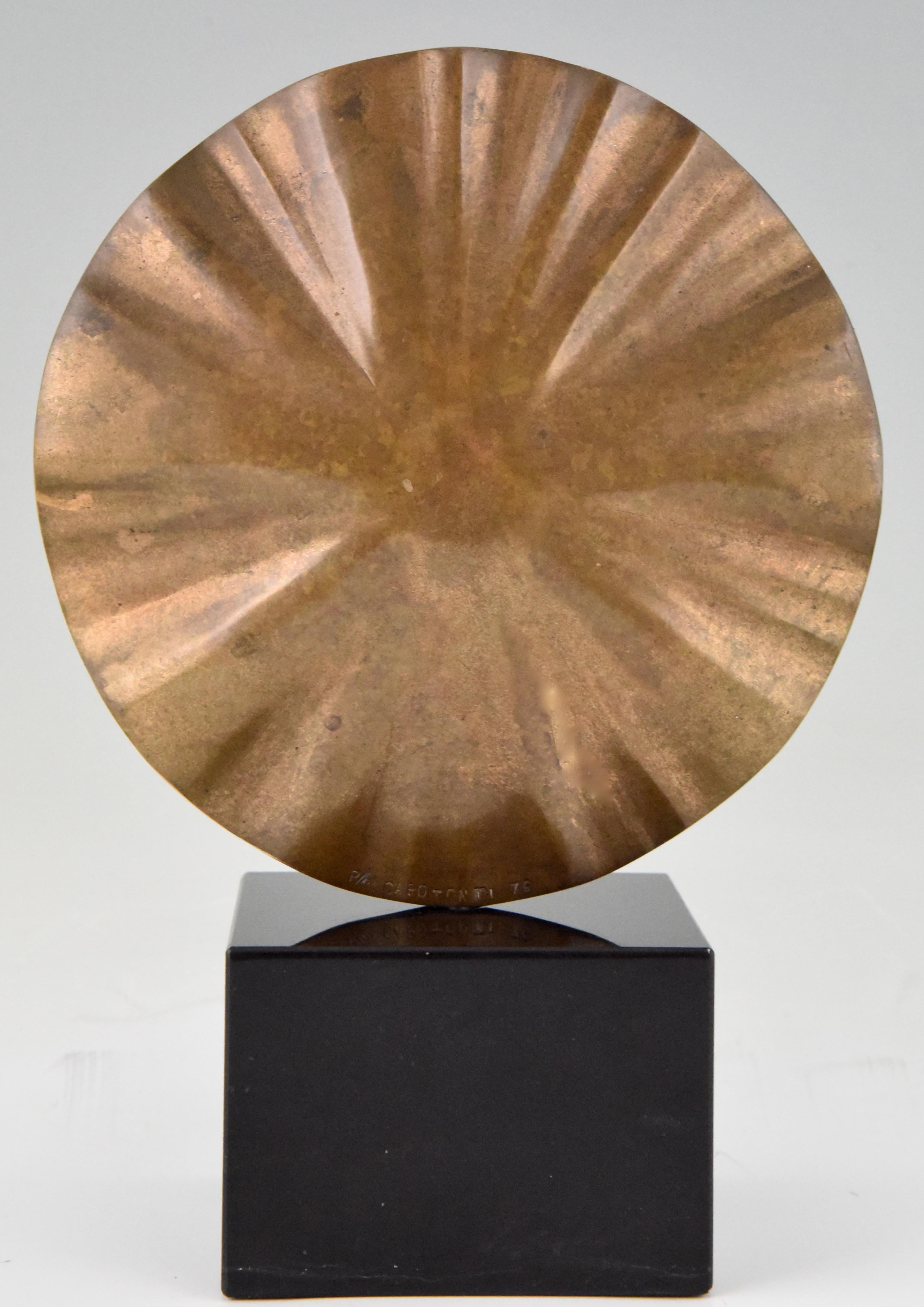 Stylish Mid-Century Modern abstract bronze sculpture by the Italian artist Claudio Capotondi, signed and dated 1979. The sculpture stands on a black marble base and can be turned.

Claudio Capotondi, born in the old Etruscan city of Tarquinia in