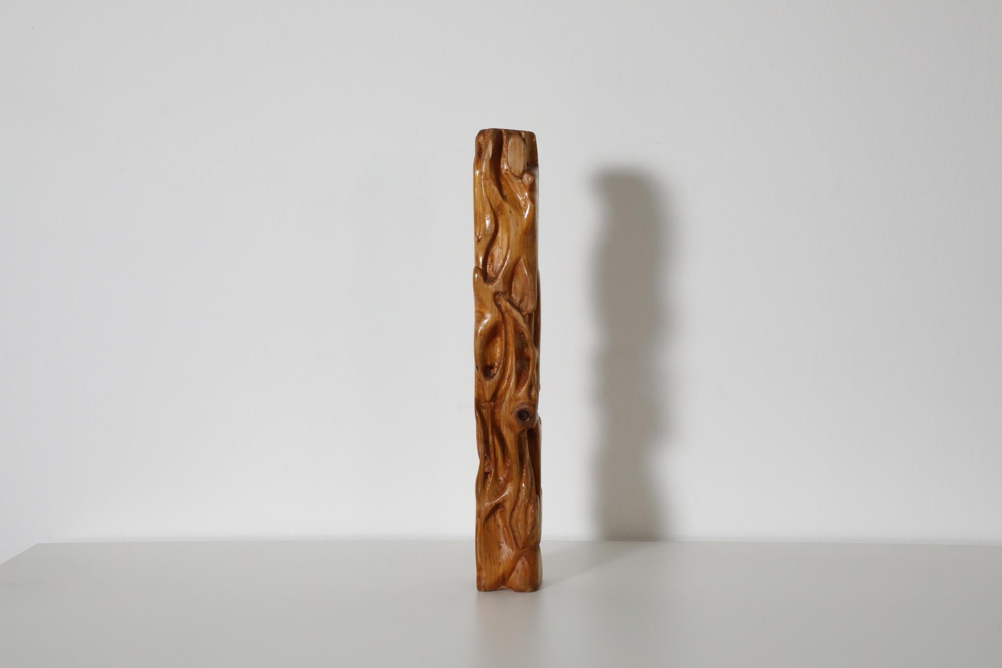 Unique, Mid-Century pine totem sculpture. A beautifully carved abstract home accessory adorned with intricate detail. In original condition with visible wear consistent with its age and use.