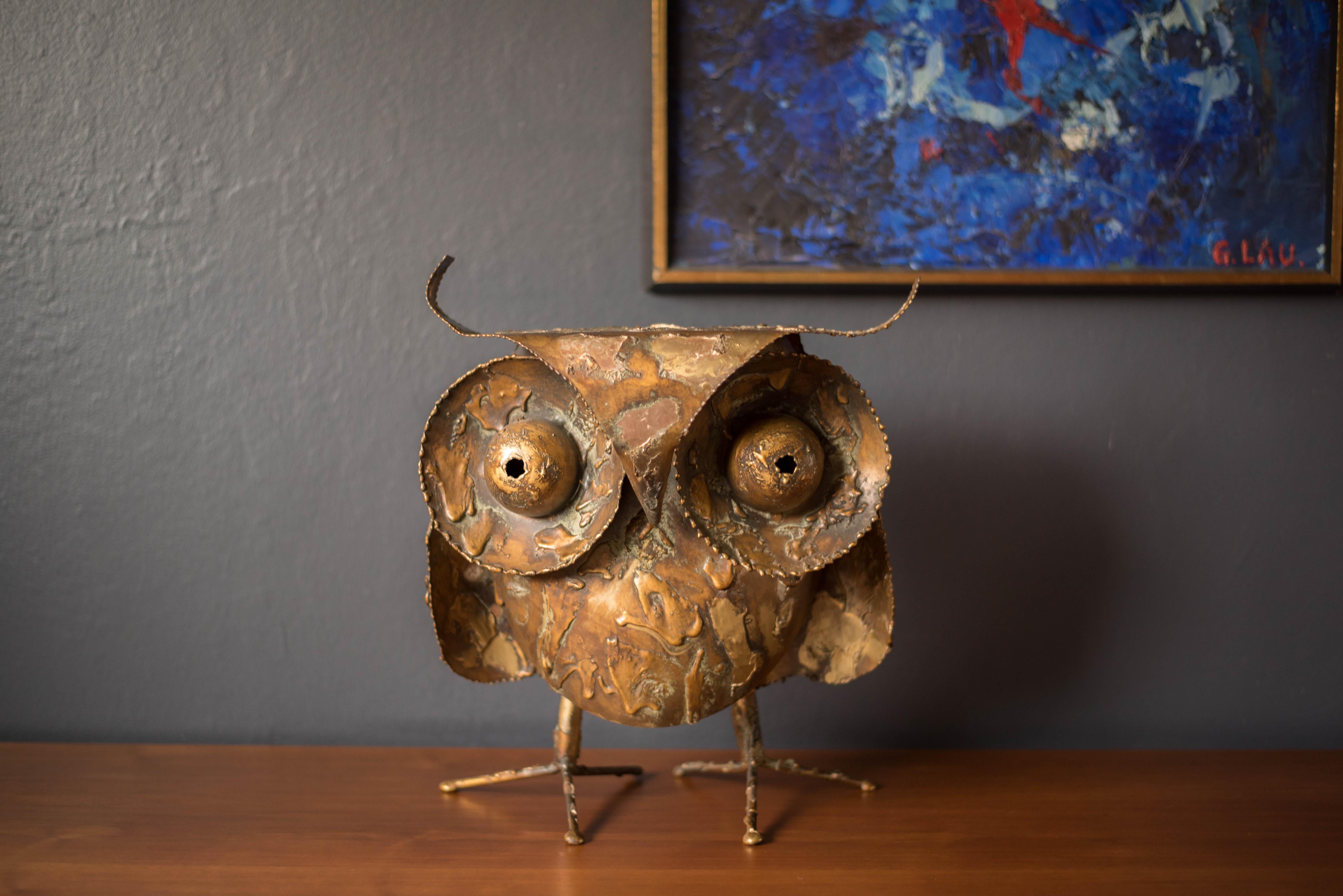 Vintage original large abstract metal owl sculpture designed by Curtis Jere for Artisan House signed '69. This playful art piece will light up any room featuring dramatic oversized eyes and feet. The sculpture displays plenty of patina and vintage