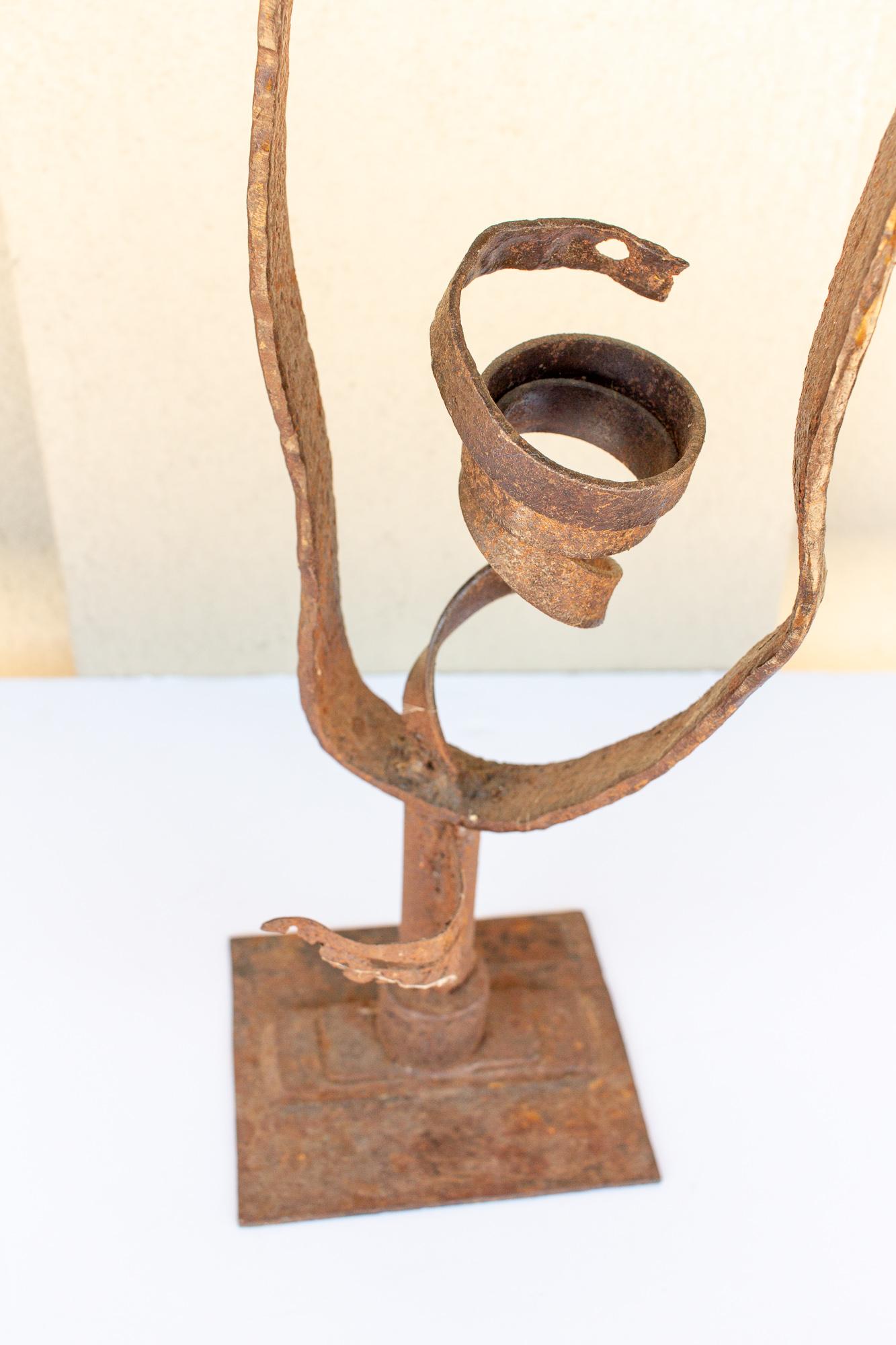 This midcentury artwork was found in France and has unknown origins. Crafted with iron, this whimsical piece could be displayed indoors or out. Placed outside upon a fitting pedestal with its seemingly reaching strands it could be a trigger for a