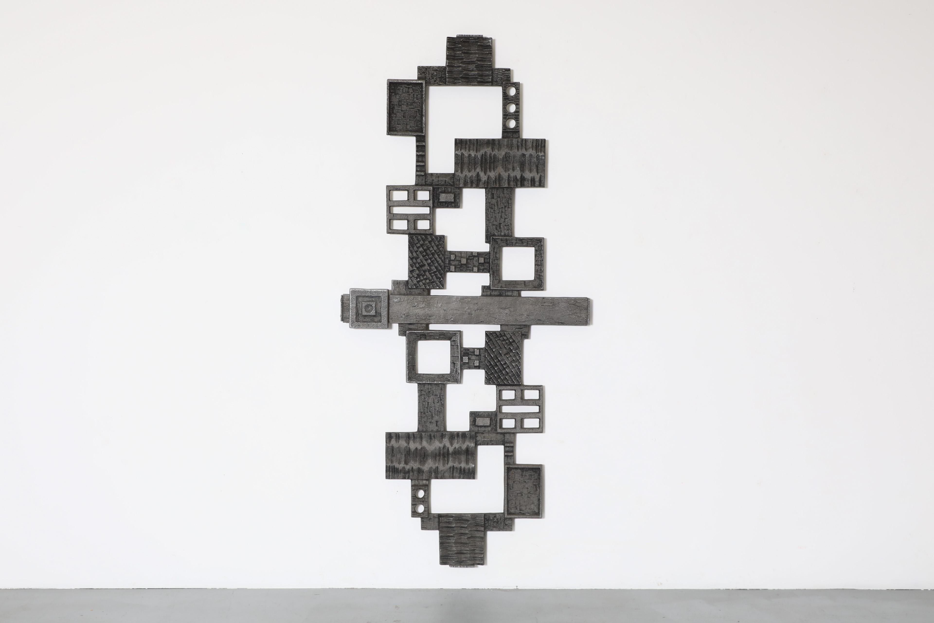 Incredible Mid-Century abstract brutalist door panel. Jagged edges and decorative carvings highlight its raw and dynamic geometric presence. An artistic wall accessory in original condition with wear consistent with its age and use. A matching wall
