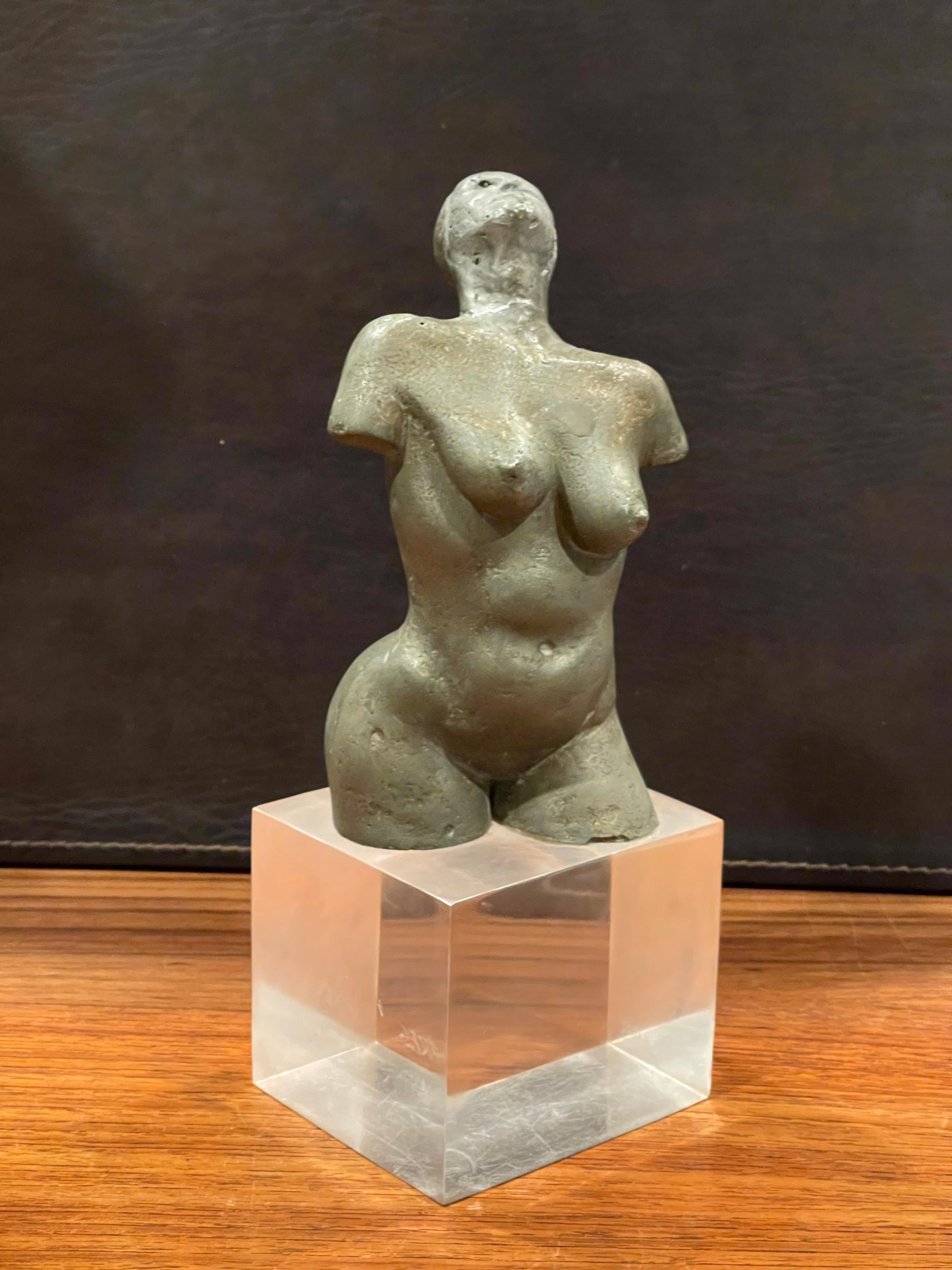 Mid-century abstract nude sculpture on lucite base by listed California artist Ken Vares, circa 1960s. The piece is made of a porous metal, possibly aluminum, well detailed and signed on the base. This very cool and eclectic piece is in good vintage