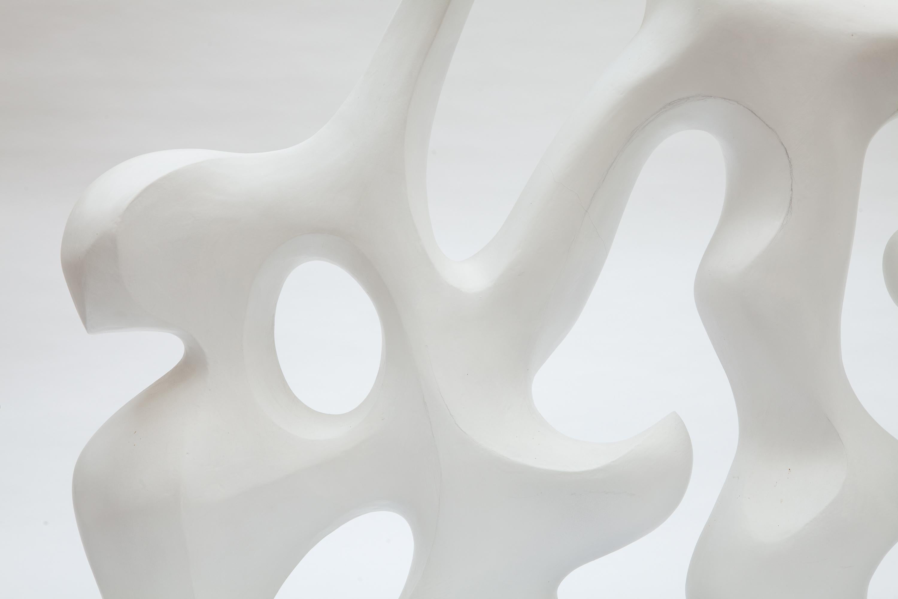 Large abstract sculpture by an unknown artist. Form, line and surface are used as the visual language, the sculpture is abstracted to a Minimalist form. The primary material, resin molded is masked by white paint to allow the form to take precedence