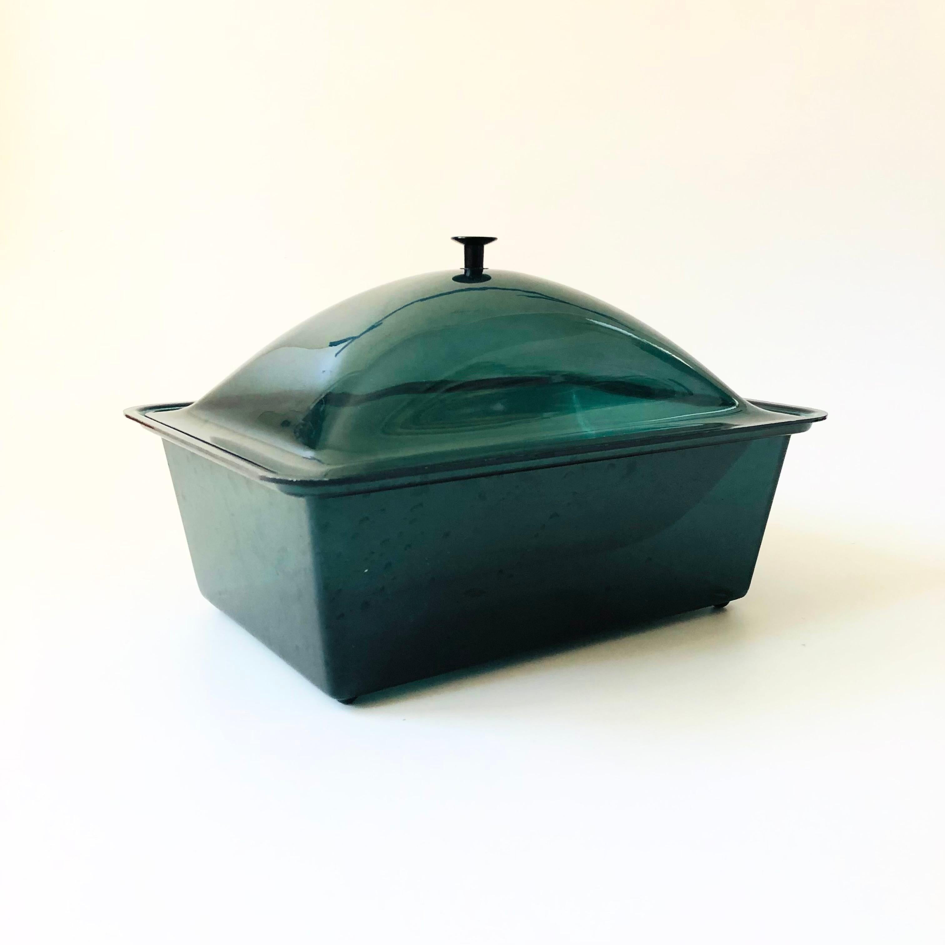 A great mid century acrylic server. Dark green tint to the acrylic with a white interior tray. Ice can be stored in the base for keeping dishes cold. Perfect for serving fruit, pasta salad, or other cold dishes.

