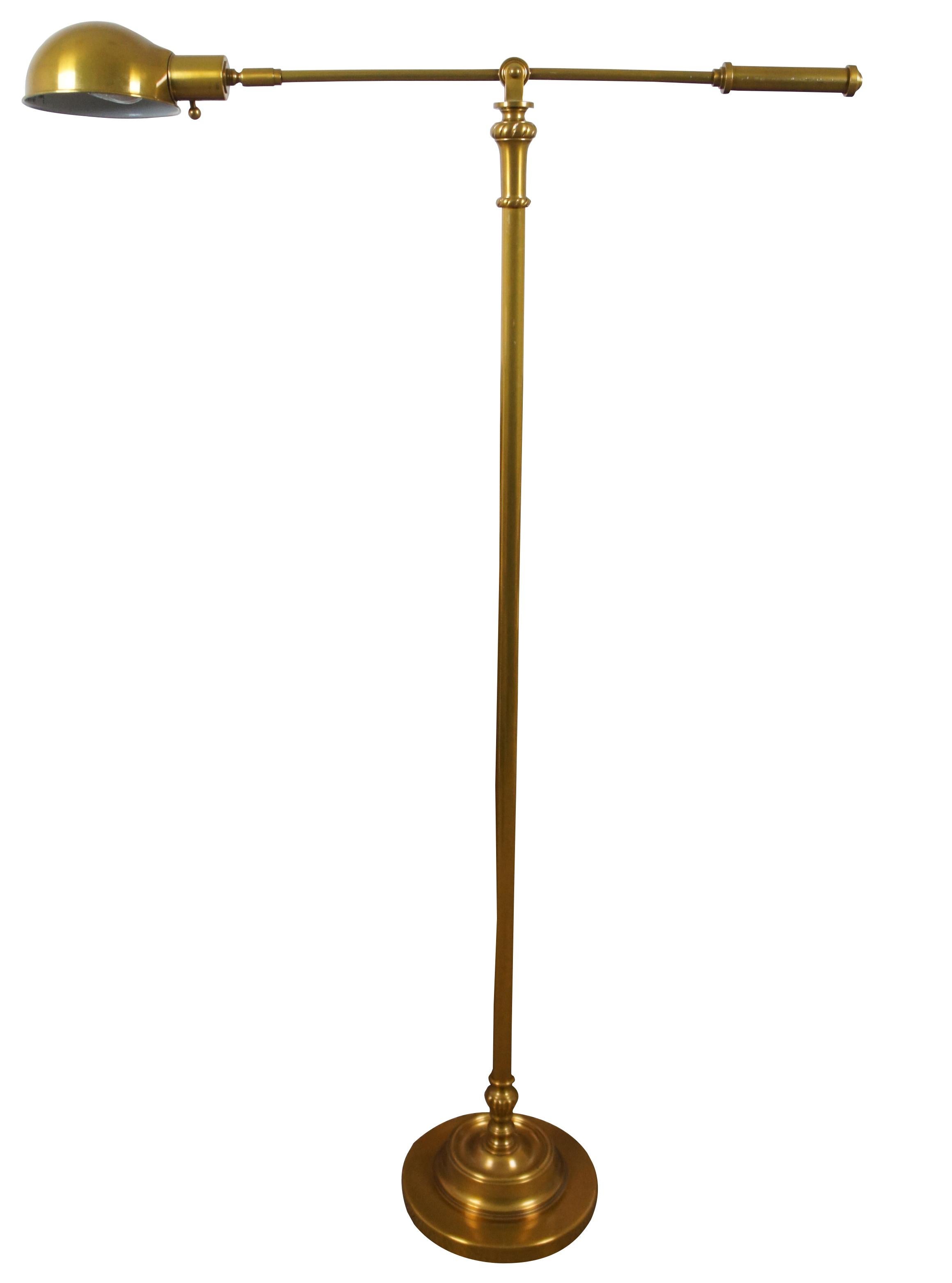 Mid century brass reading lamp with swivel arm.

Measures: 10” x 53.75” to 67” / Arm - 33.5” x 6.5” (Diameter x Height/Length x Width).