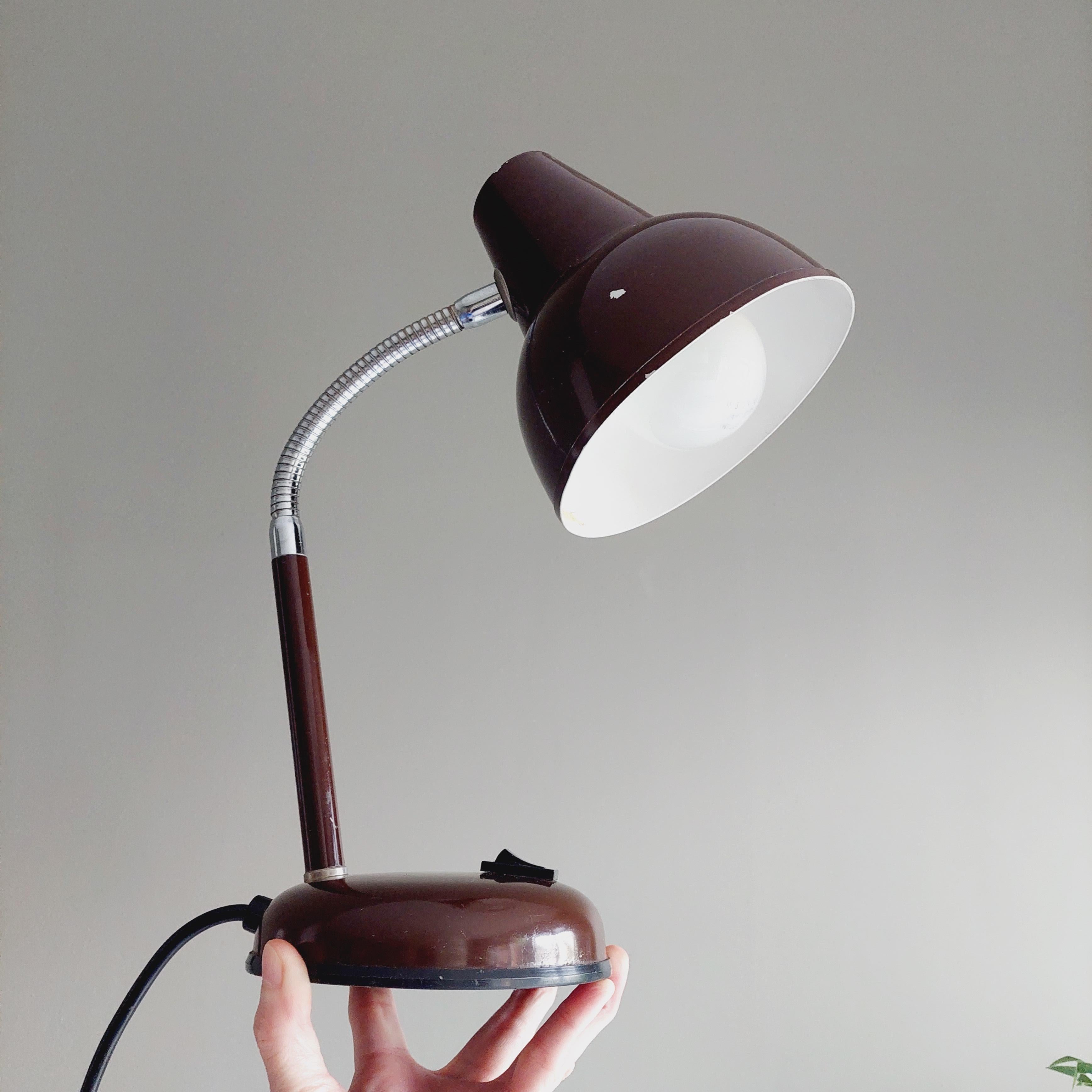 1970s Retro Desk Lamp Made in Italy by Veneta Lumi for BHS in the UK - original label on base. 
Vintage brown metal desk lamp Bauhaus style mid-century

Brown painted metal shade and base.
Goose nek, flexible chrome metal stem. 
Switch part-way down