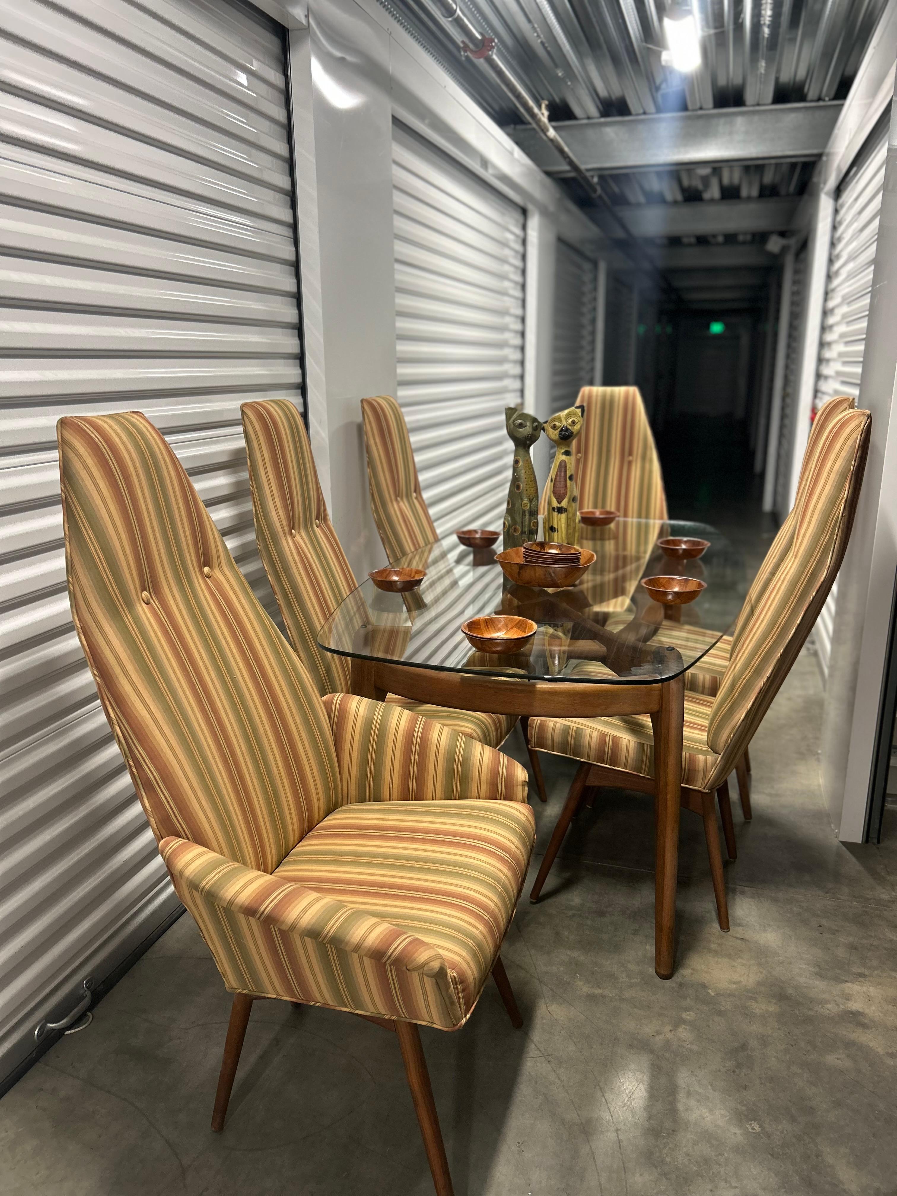 This is an incredible COMPLETE dining set by Adrian Pearsall for Craft Associates. Not often will you find the larger table and 6 chairs as a set. 

It includes Pearsall's rectangular 