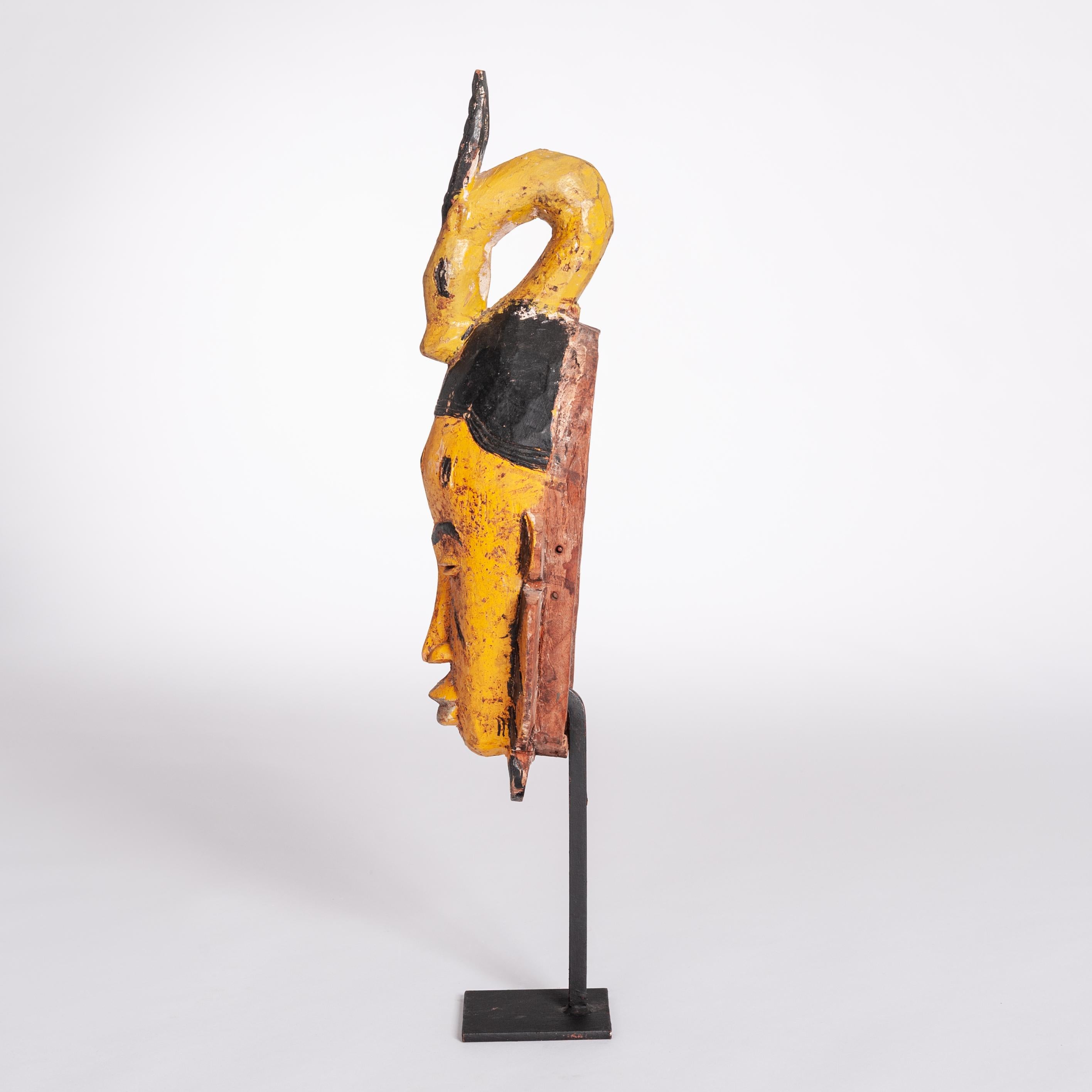 Carved Mid-Century Baoule Tribal Mask in Yellow-Black with Antelope Head Decoration For Sale