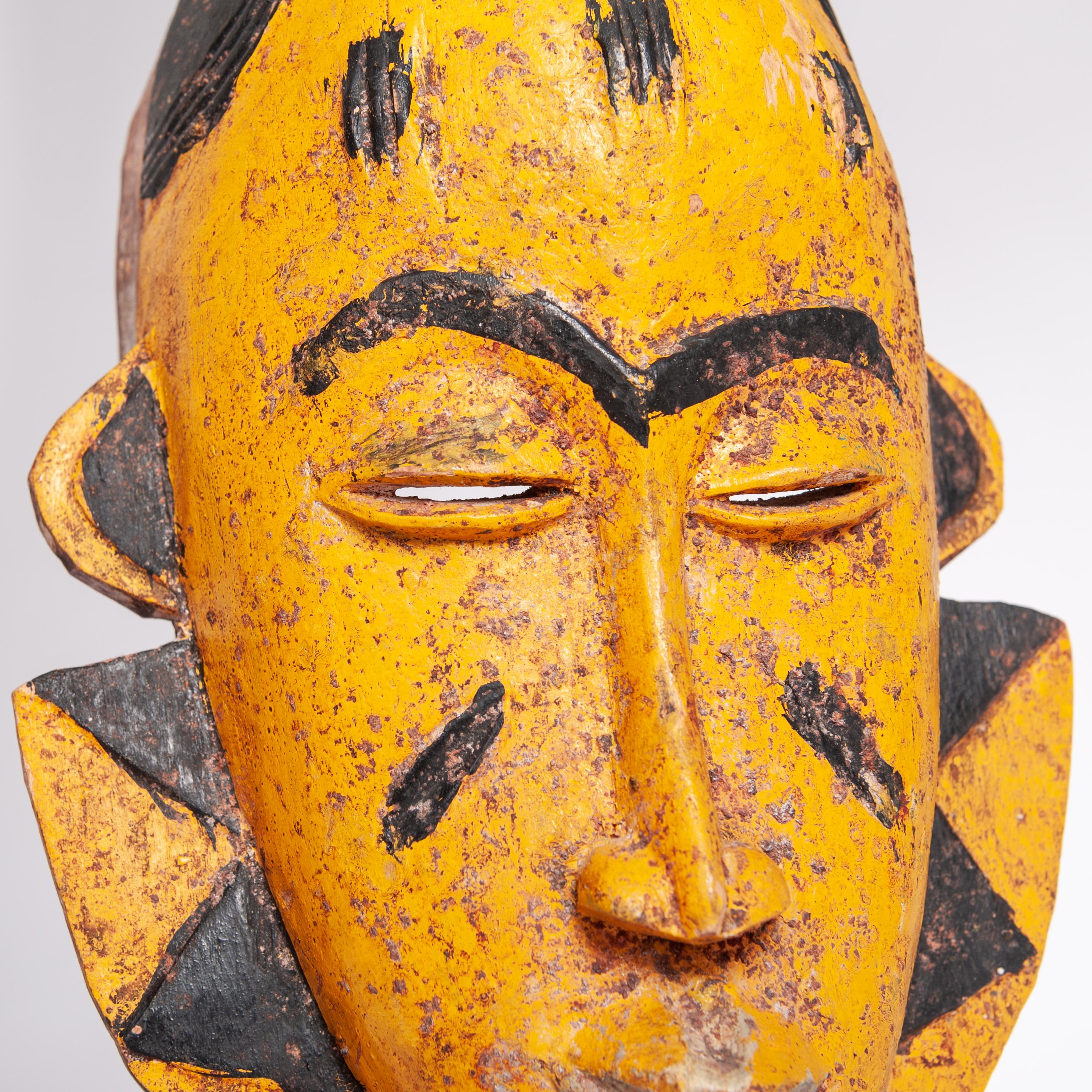 Wood Mid-Century Baoule Tribal Mask in Yellow-Black with Antelope Head Decoration For Sale