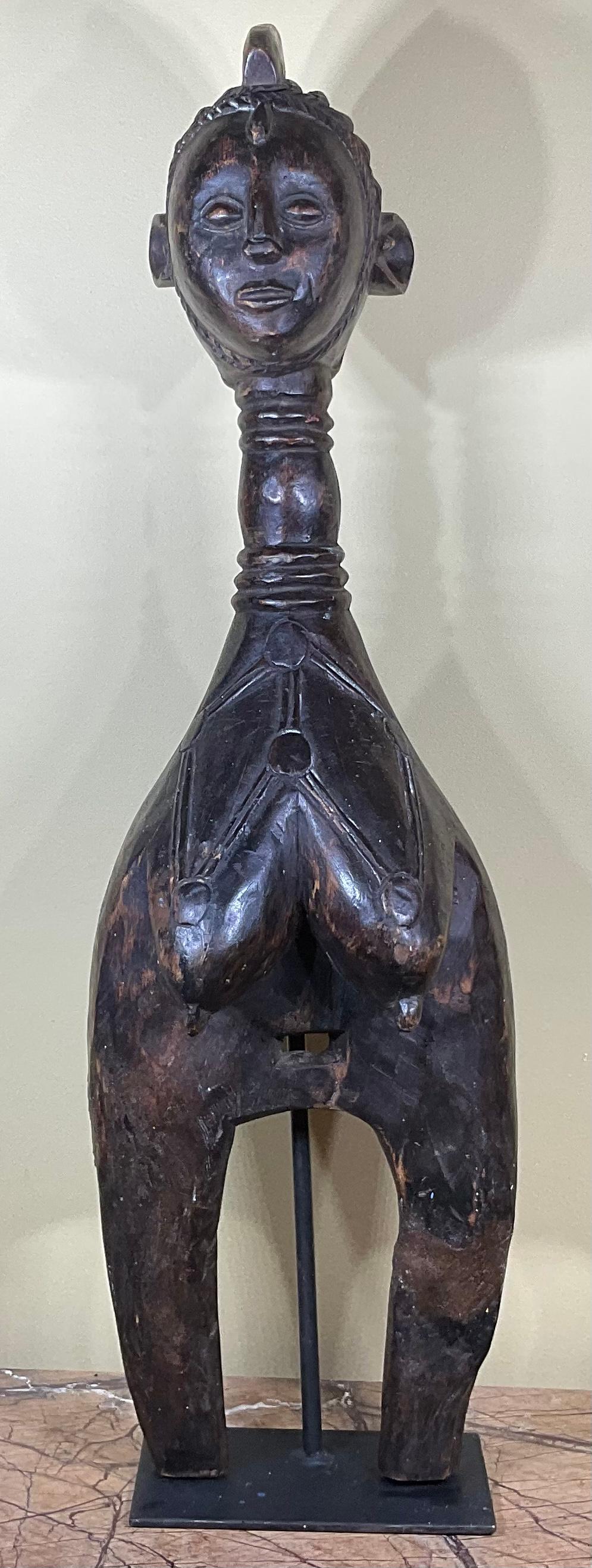 Exceptional African wood carving ,mounted on custom-made steel base of women graciously looking forward, beautiful facial expression, and very nice and intricate hairdo.
Great object of art for display.