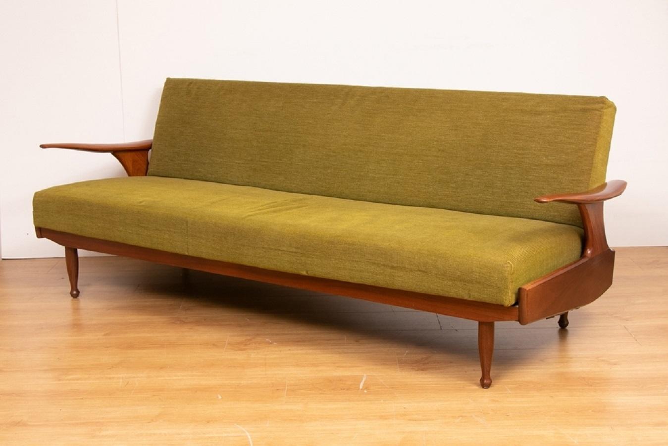 A British mid century sofa bed by Greaves and Thomas with afrormosia frame and original upholstery.

Measures: H: 74cm, W: 204.3, D: 86cm-112cm.