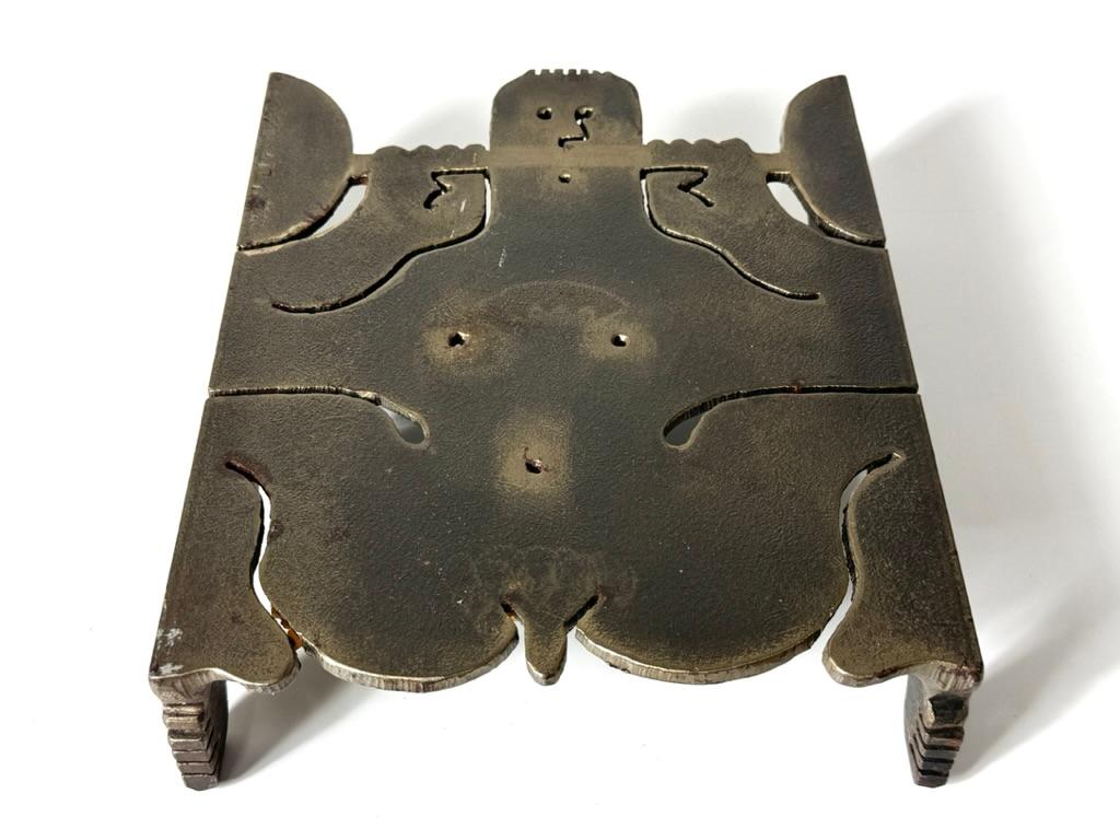Whimsical abstract steel trivet by New York artist Albert Leon Wilson 1977

Nude figure cut from steel and titled 