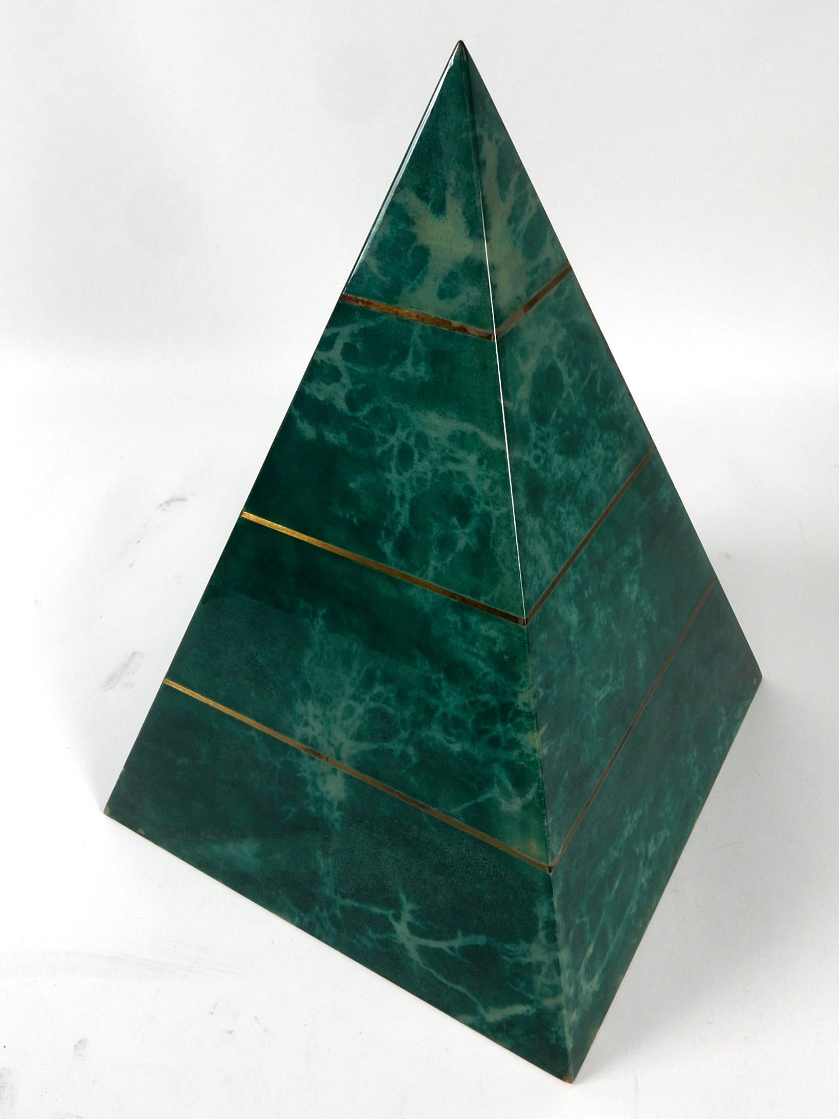 Large decorative pyramid wrapped in greenish blue dyed goatskin then covered in a glossy lacquer. Brass accents. Labeled with Aldo Tura tag. 