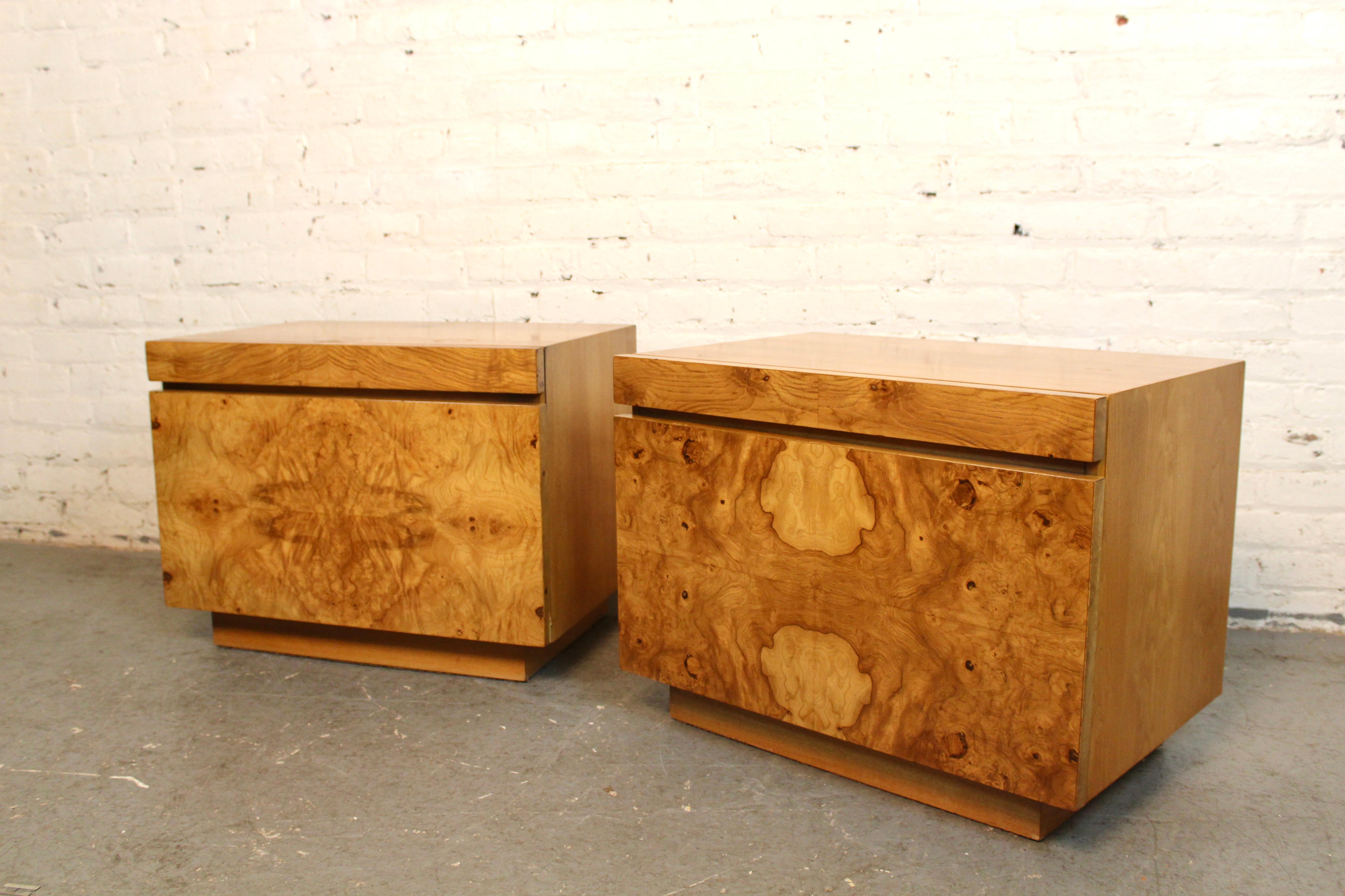 Timeless yet modern, the renowned “Alpha” series by designer Roland Carter for Lane Furniture of Virginia seamlessly blends clean brutalist lines with the wild organic swirls of oak burl wood. This stunning pair of nightstands features two spacious