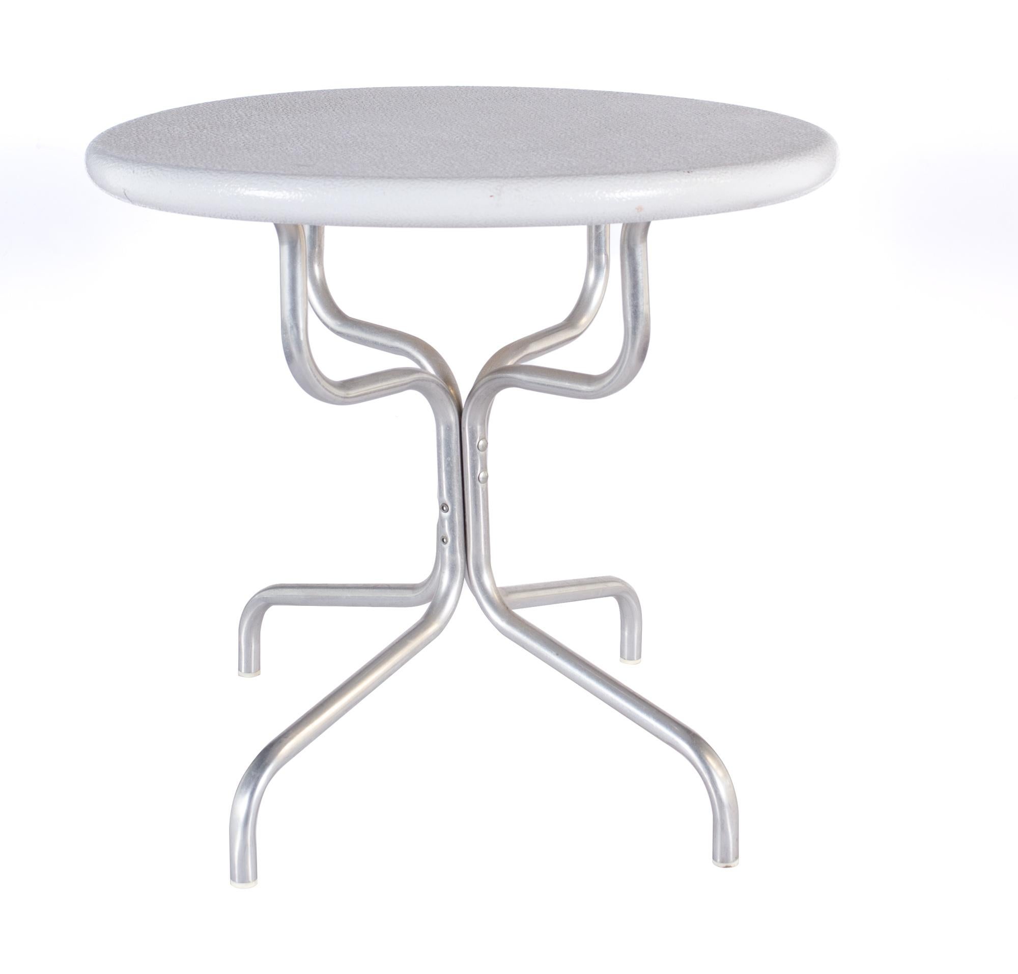 Mid-century aluminum white painted side table

The table measures: 22 wide x 22 deep x 20 inches high, with a chair clearance of 18.8 inches

All pieces of furniture can be had in what we call restored vintage condition. That means the piece is