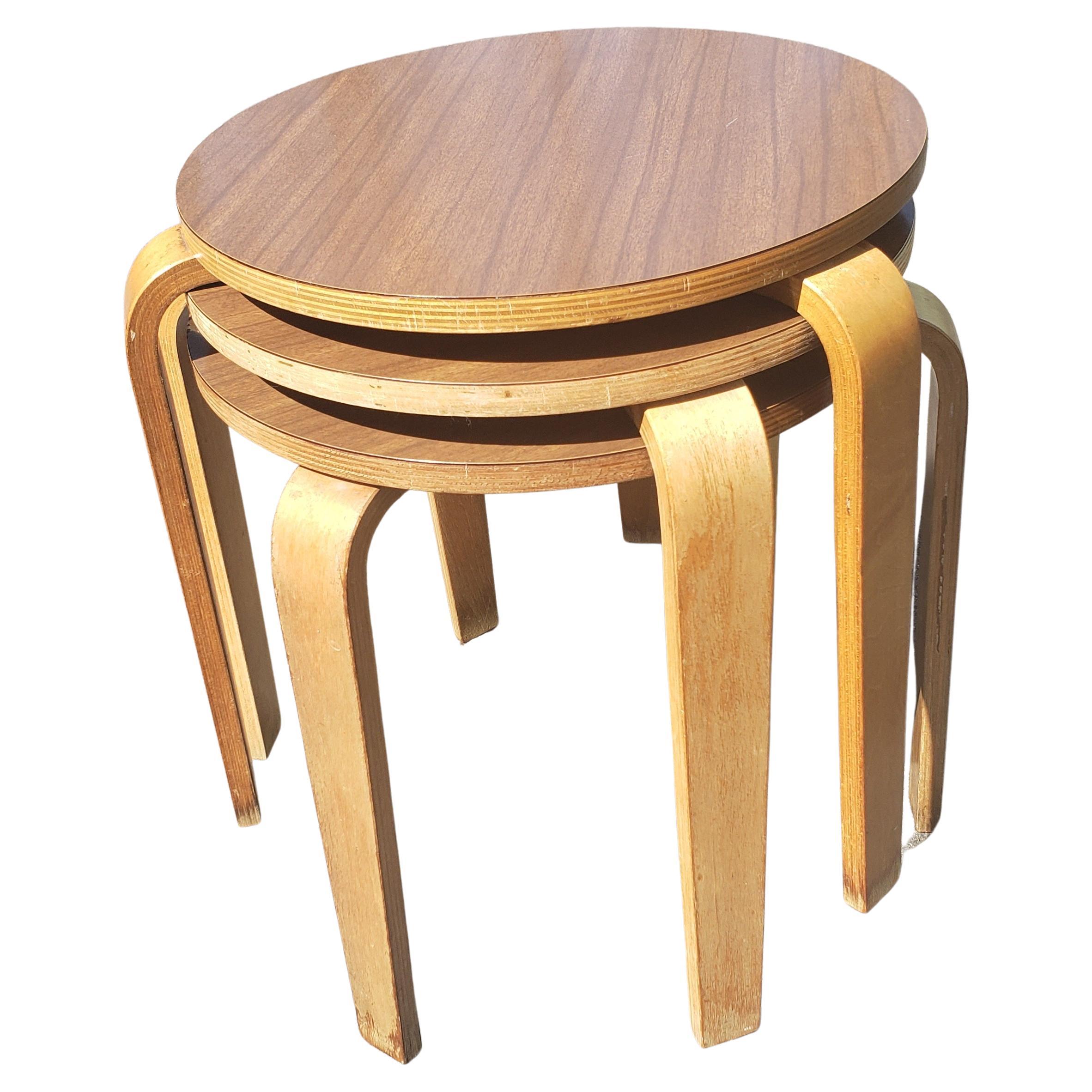 Beautiful mid century Alvar Aalto tables / stools manufactured by Artek, Model 60, Circa 1940s,
Stacking tables. Bentwood and formica top. Very good vintage condition. Wear appropriate with age and use. Minor finish losses on legs ends.

Measures