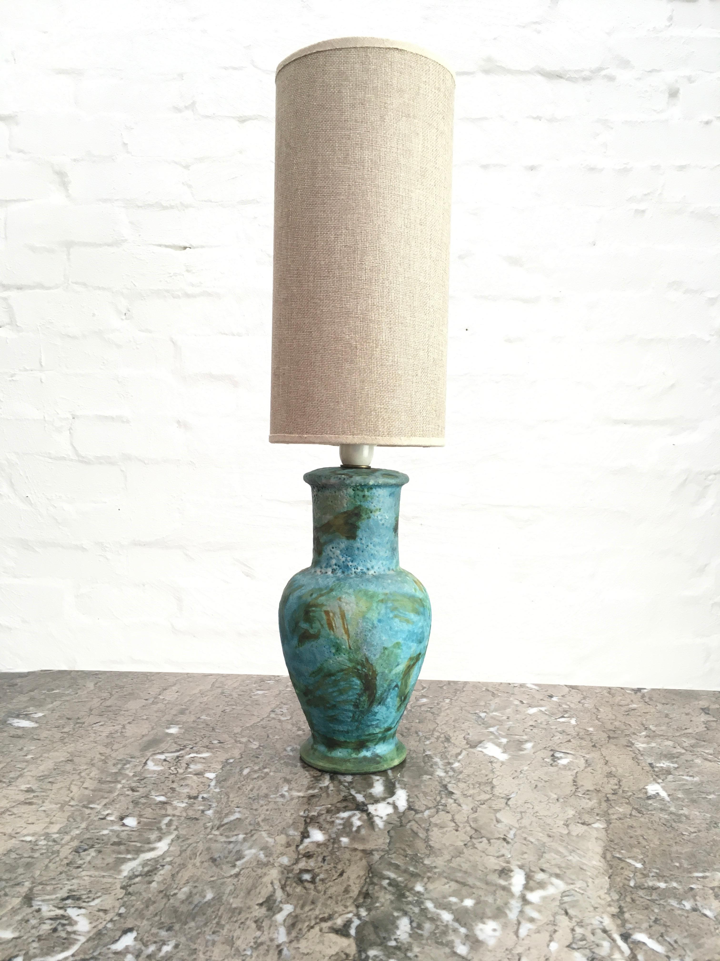 A small sea garden glazed ceramic lamp by Alvino Bagni, probably for Raymor. Comes with its own petite cylindrical custom made vintage shade in hessian.

We love this lamp in an intimate corner, perhaps on a cocktail trolley or side table. It has