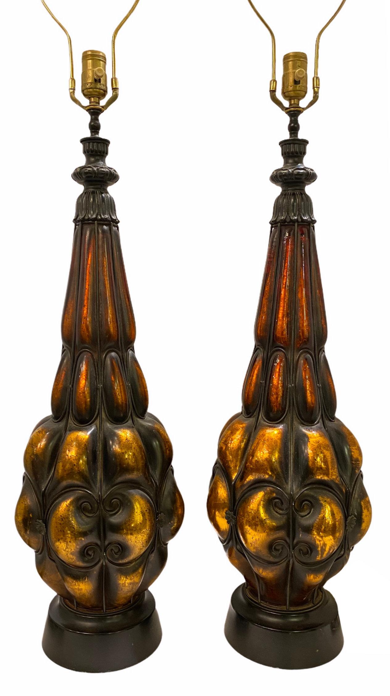 Mid-century amber blown molded metal table lamps.