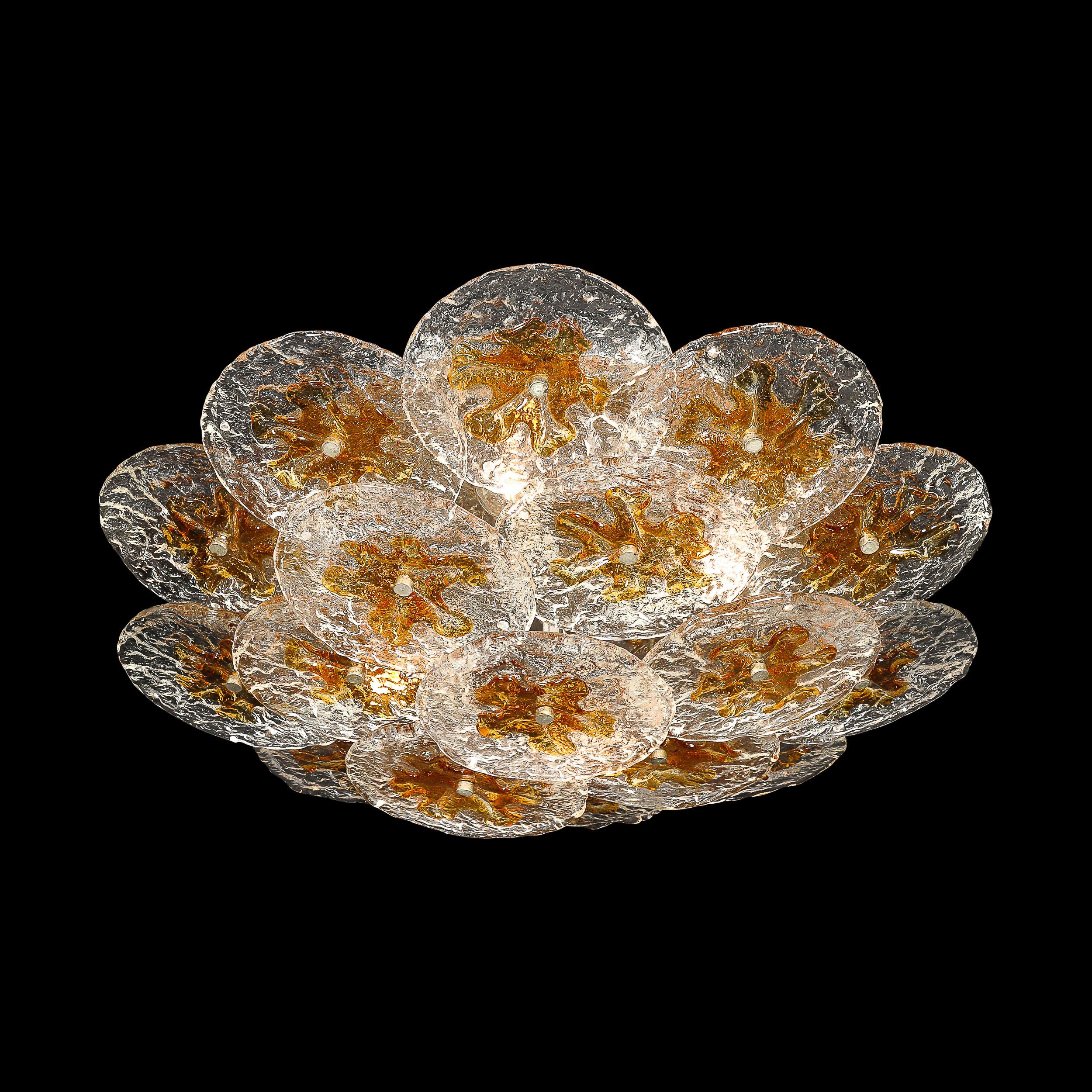 This stunning and elegant Mid-Century Modernist Hand-Blown Murano Mottled Glass Disk Chandelier in Amber is by the esteemed designer and glass artist Mazzega and originates from Italy, Circa 1970. Features a shallow rounded composition composed of