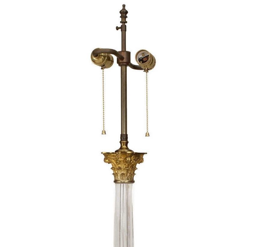 American (Mid-20th Century) crystal column table lamp with brass Corinthian capital on a square step-up base. (designed by David Barrett).

