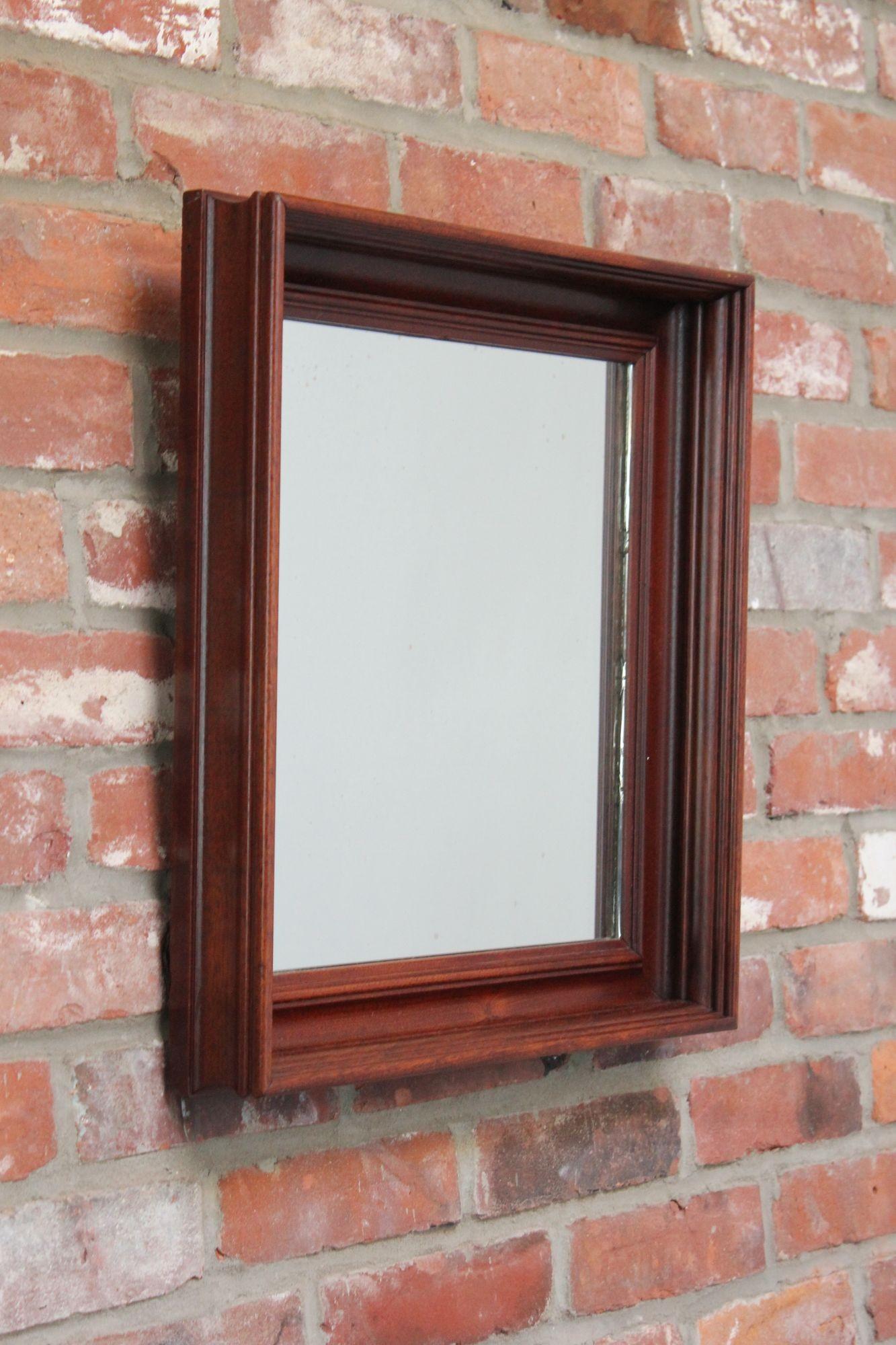 Mid-Century square wall mirror (ca. 1970s, USA). Elegant ogee frame in stained mahogany.
Spotting to glass itself in places, and one spot of wear to from itself, as shown. Overall, very good, vintage condition.
H: 19