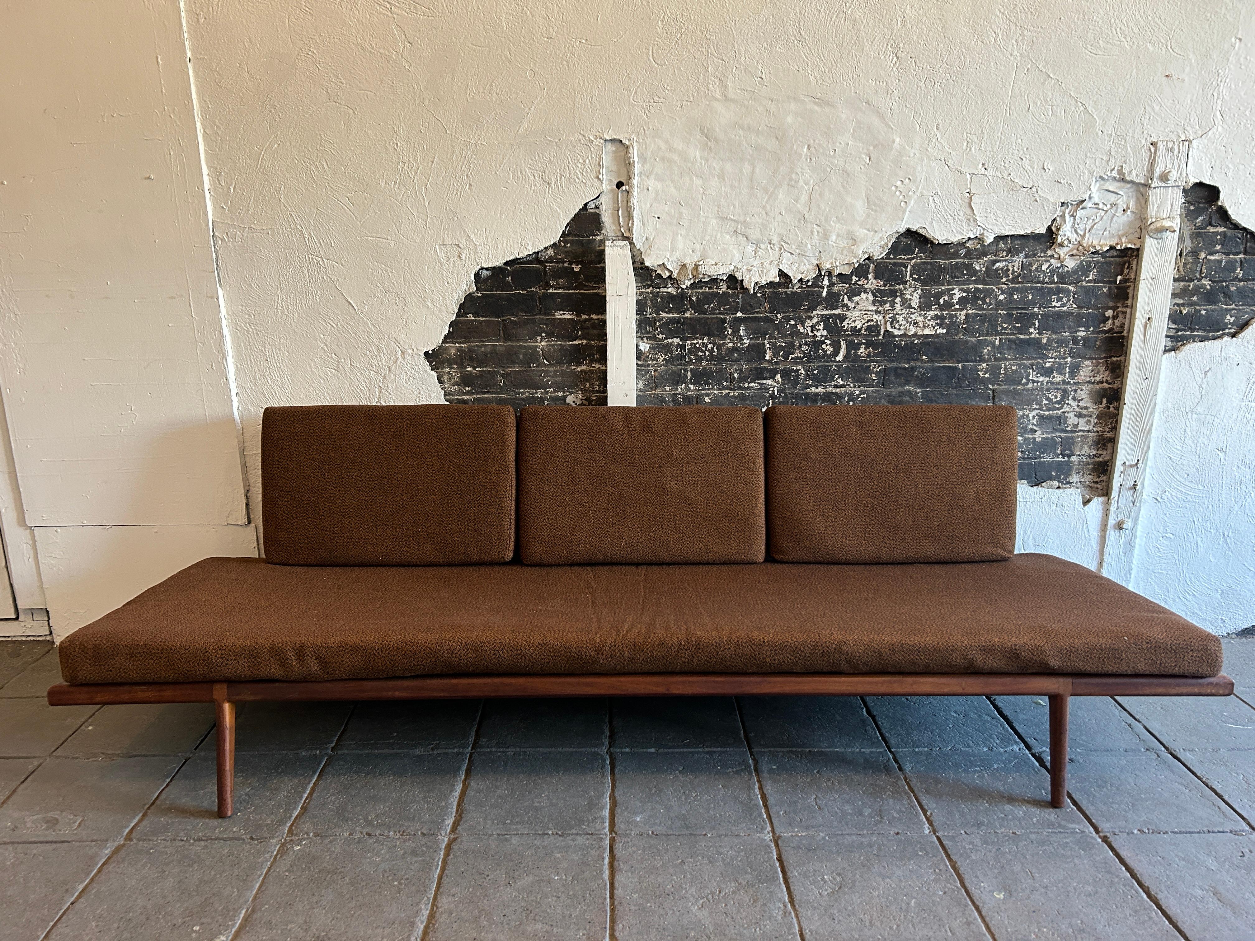 Stunning midcentury American Modern Mel Smilow Walnut frame long low sofa or daybed. Beautiful armless sofa with solid walnut sculpted frame and steel spring support insert. Has Original upholstery and foam would recommend new upholstery or use as