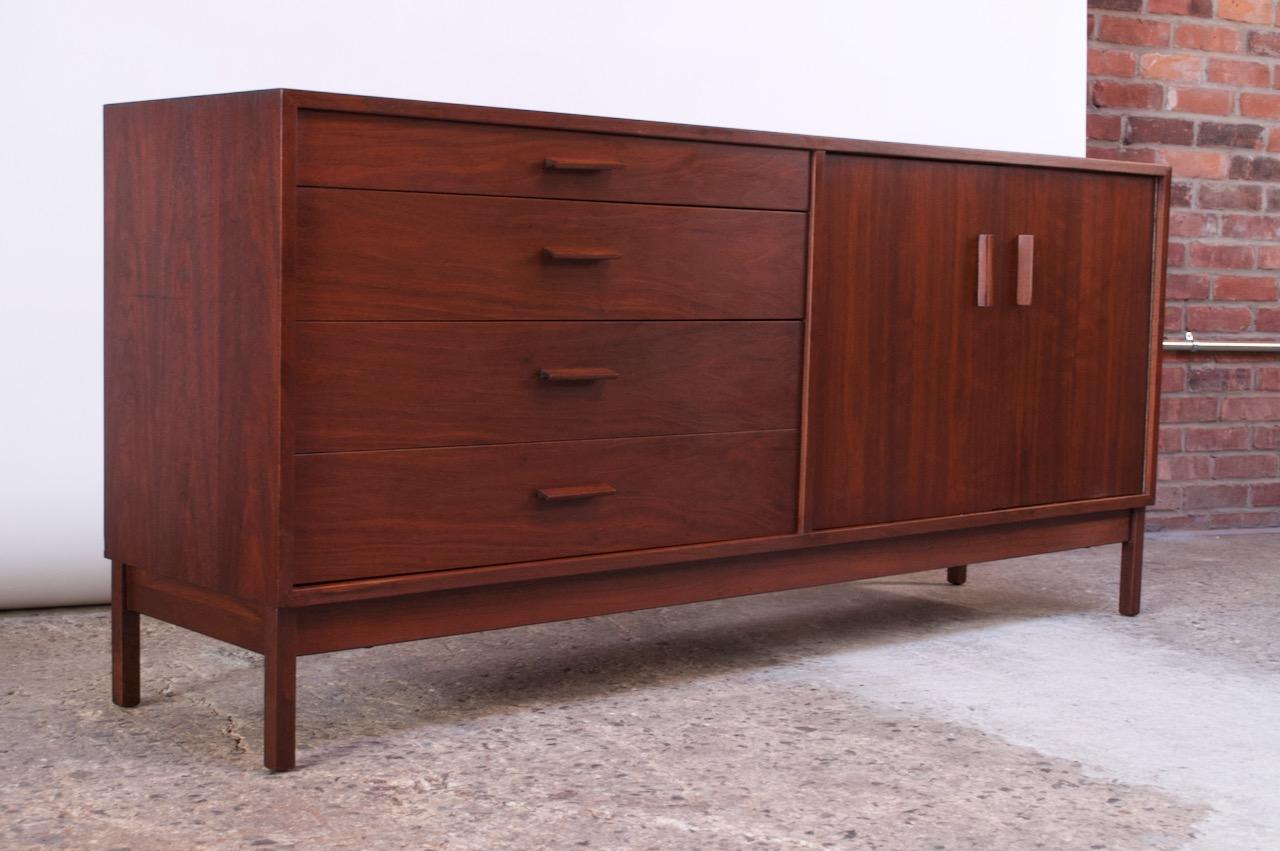 Walnut sideboard dresser by renowned painter and sculptor, Richard Artschwager, who in 1953 designed a small collection of furniture in New York City. These pieces are scarce, as production and scope of design were exceedingly limited.
This walnut