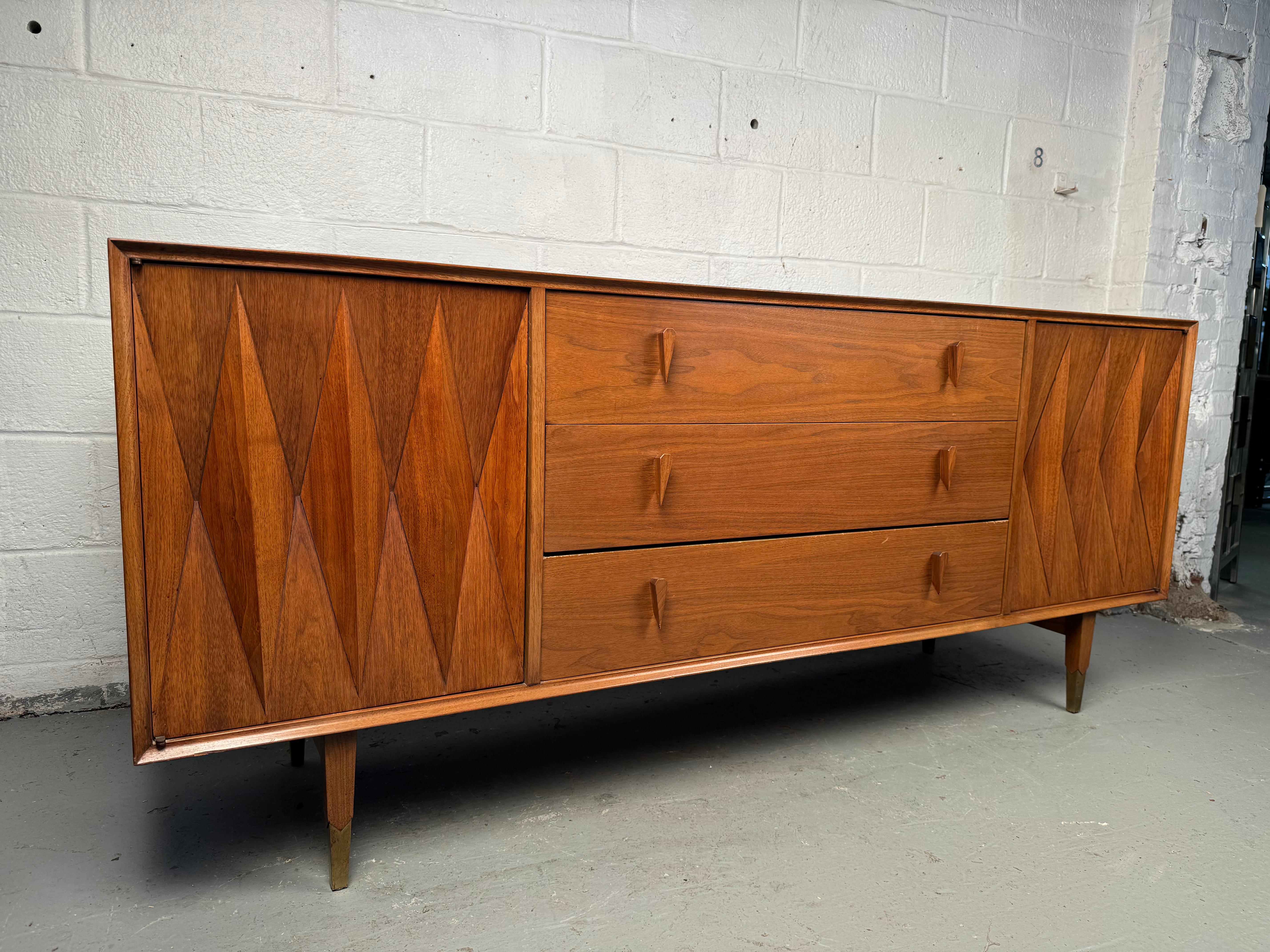 Embrace the elegance of mid-century modern design with the American of Martinsville Diamond Dresser, a true masterpiece designed by the legendary Albert Parvin. This stunning dresser effortlessly blends artistry with functionality, offering a