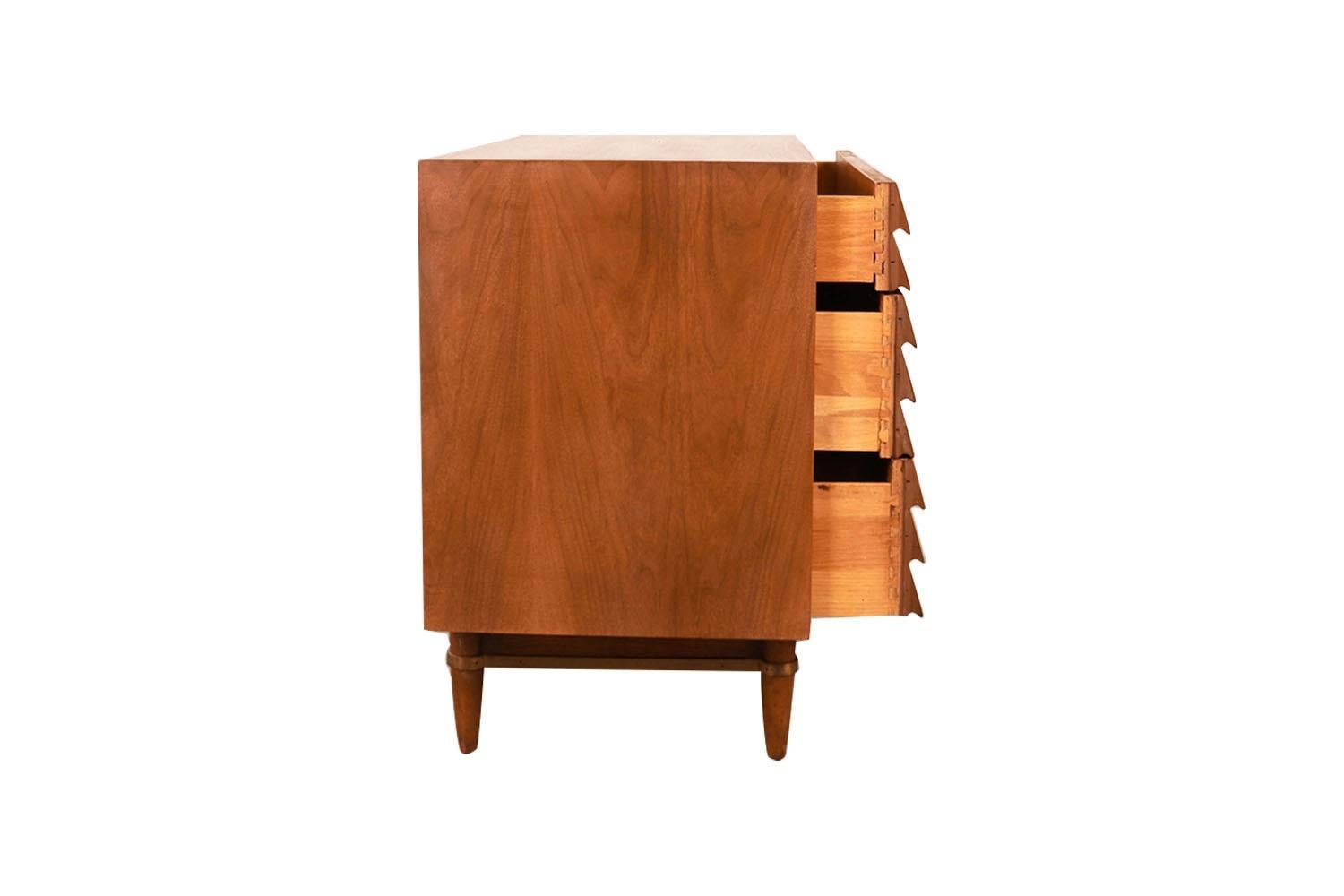 Beautifully detailed & proportioned walnut American of Martinsville bachelors chest/dresser. Designed by Merton Gershun for American of Martinsville’s “Dania” line, one of the most esteemed furniture producers of the Mid-century era. Featuring a